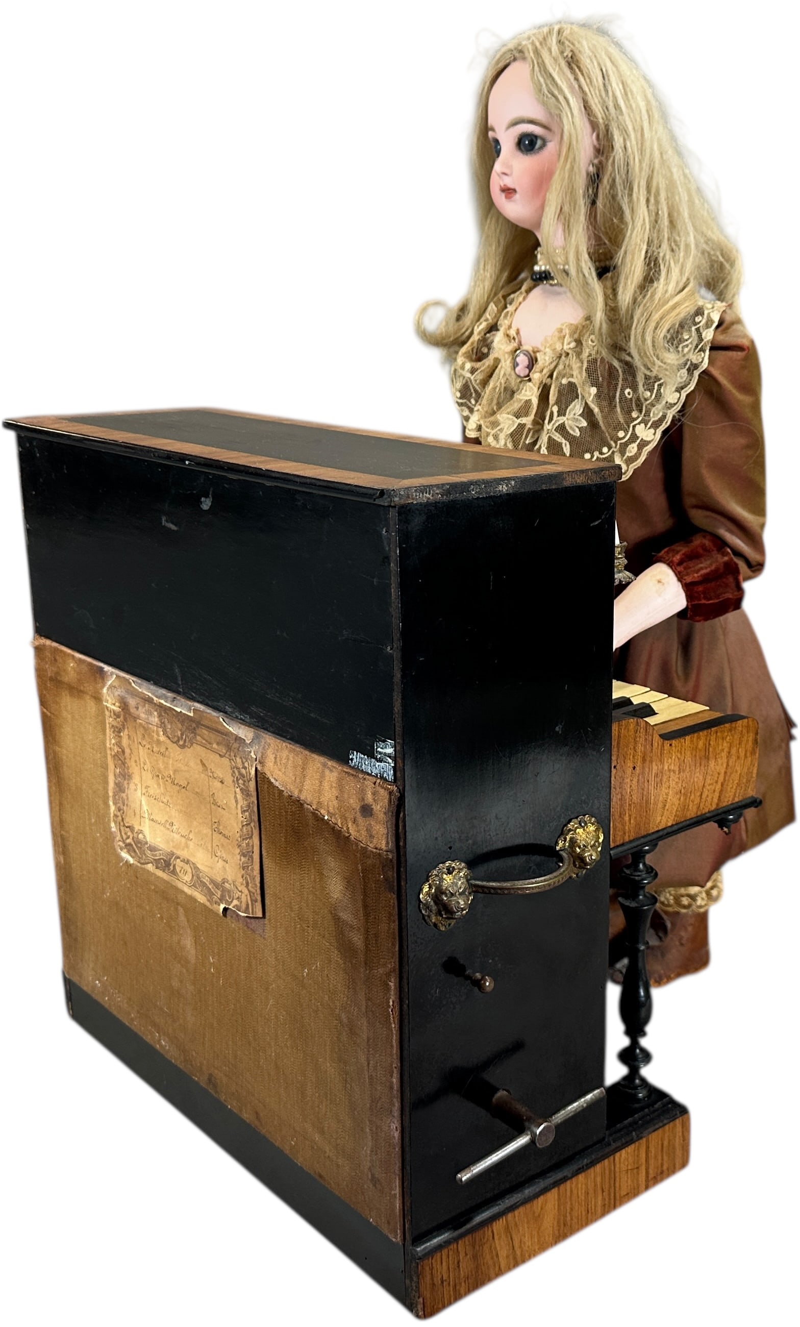JUMEAU DOLL PLAYING PIANO AUTOMATON: 409. JUMEAU DOLL PLAYING PIANO AUTOMATON | French Jumeau doll head inscribed "Depose Tete Jumeau Bre S.G.D.G. 7", beautifully dressed doll stands at the upright piano decorated with two candelabras, c