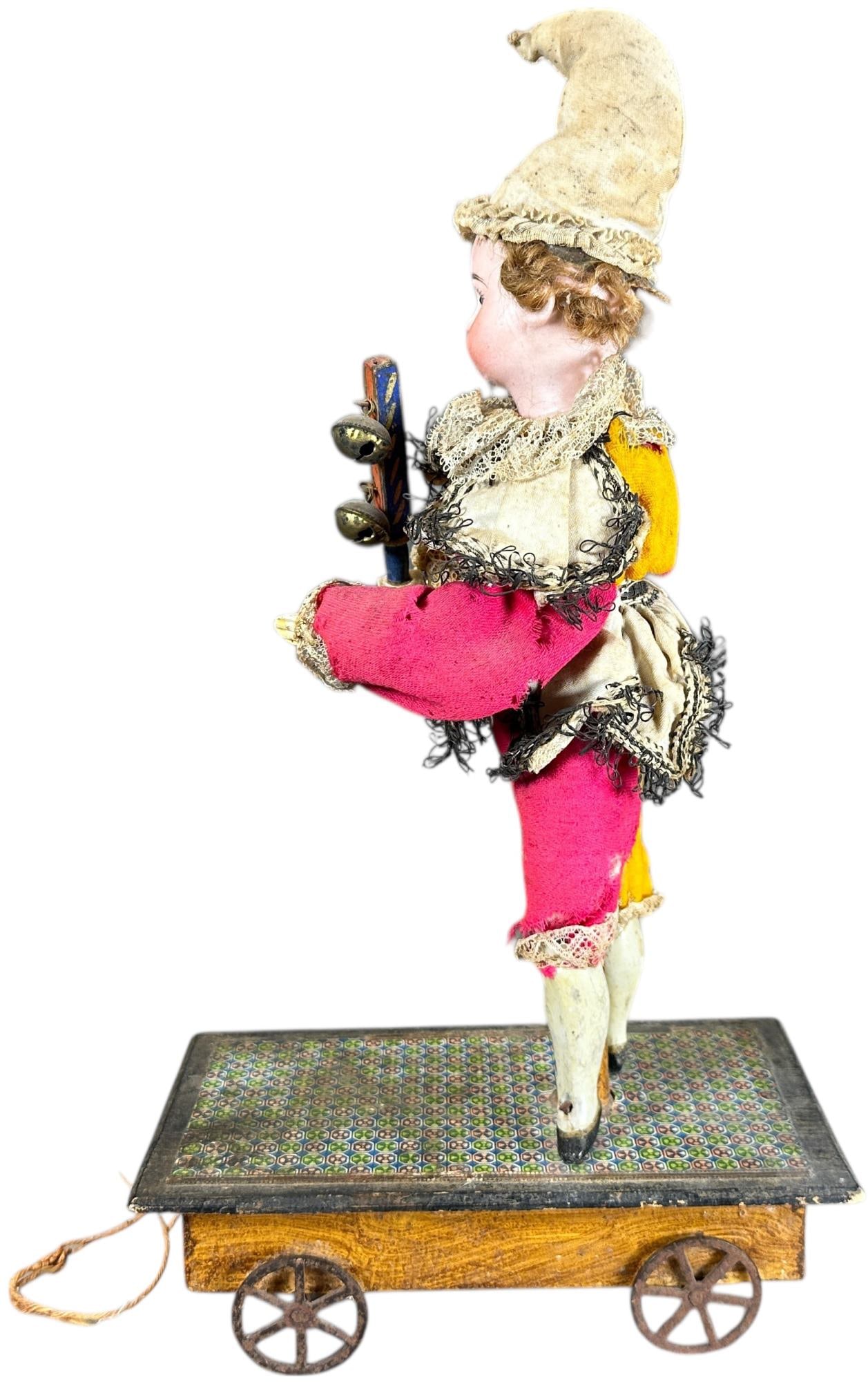 MECHANICAL BISQUE HEAD CLOWN PULL TOY - 6