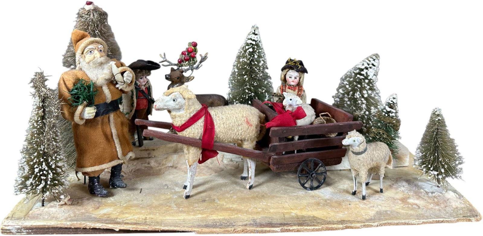 CHRISTMAS WAGON IN THE WOODS DISPLAY: 304. CHRISTMAS WAGON IN THE WOODS DISPLAY | 17.5" l. | Assembled display using primarily old parts and items, (Excellent Condition) | $400 - $700
