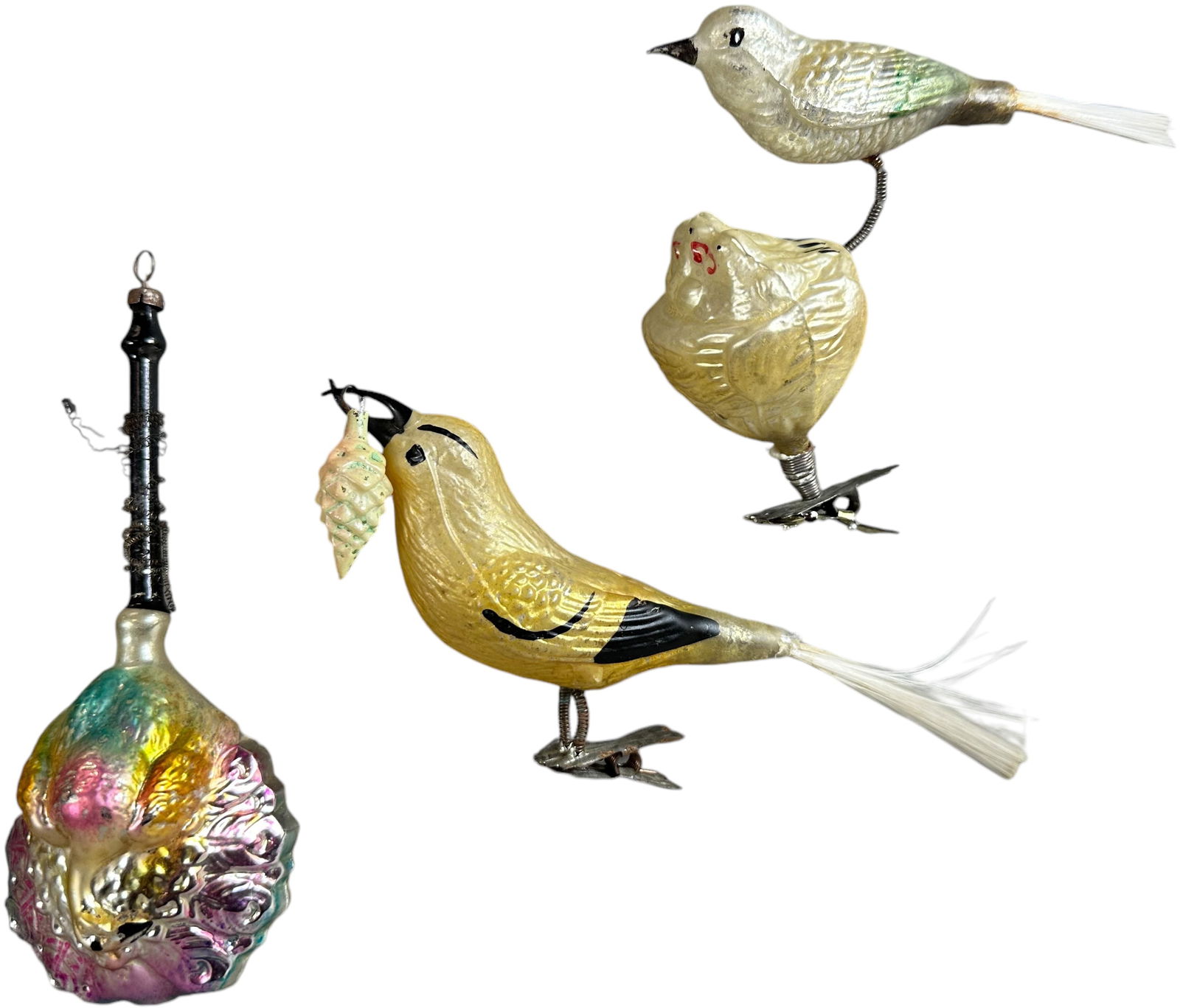 THREE GLASS BIRD ORNAMENTS: 1025. THREE GLASS BIRD ORNAMENTS | Two clip on and one rattle with peacock German glass ornaments. | 4"-6" h. | (Excellent Condition) | $200 - $400