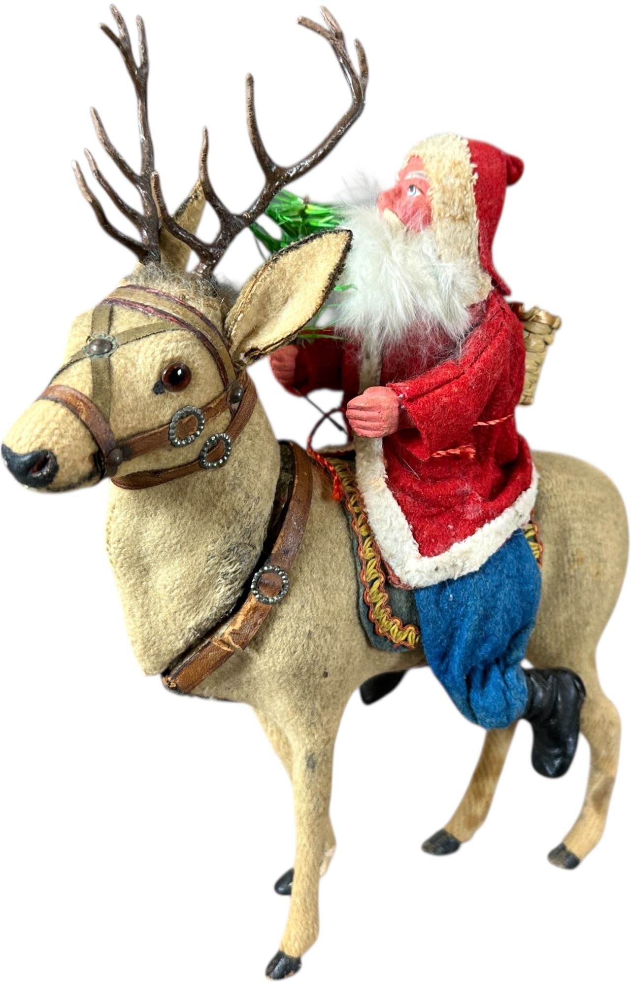 SANTA ON A REINDEER CANDY CONTAINER: 1030. SANTA ON A REINDEER CANDY CONTAINER | Reindeer is a great example, German made early 1900's. Provenance: Linda Morrow Collection | 8.5" l. | (Excellent Condition) | $1,000 - $2,000