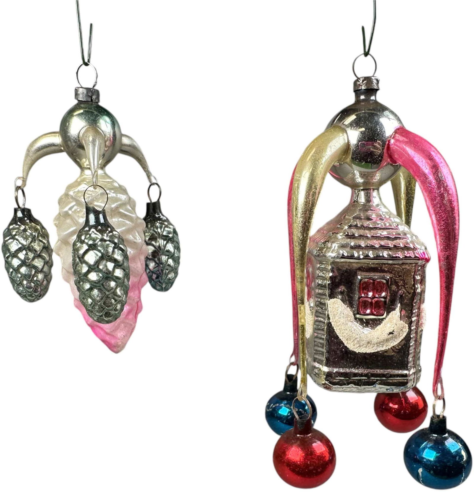 TWO FANTASY PIECE GLASS ORNAMENTS: 1068. TWO FANTASY PIECE GLASS ORNAMENTS | Extended arm. | 4"-5.5" h. | (Excellent Condition) | $250 - $500