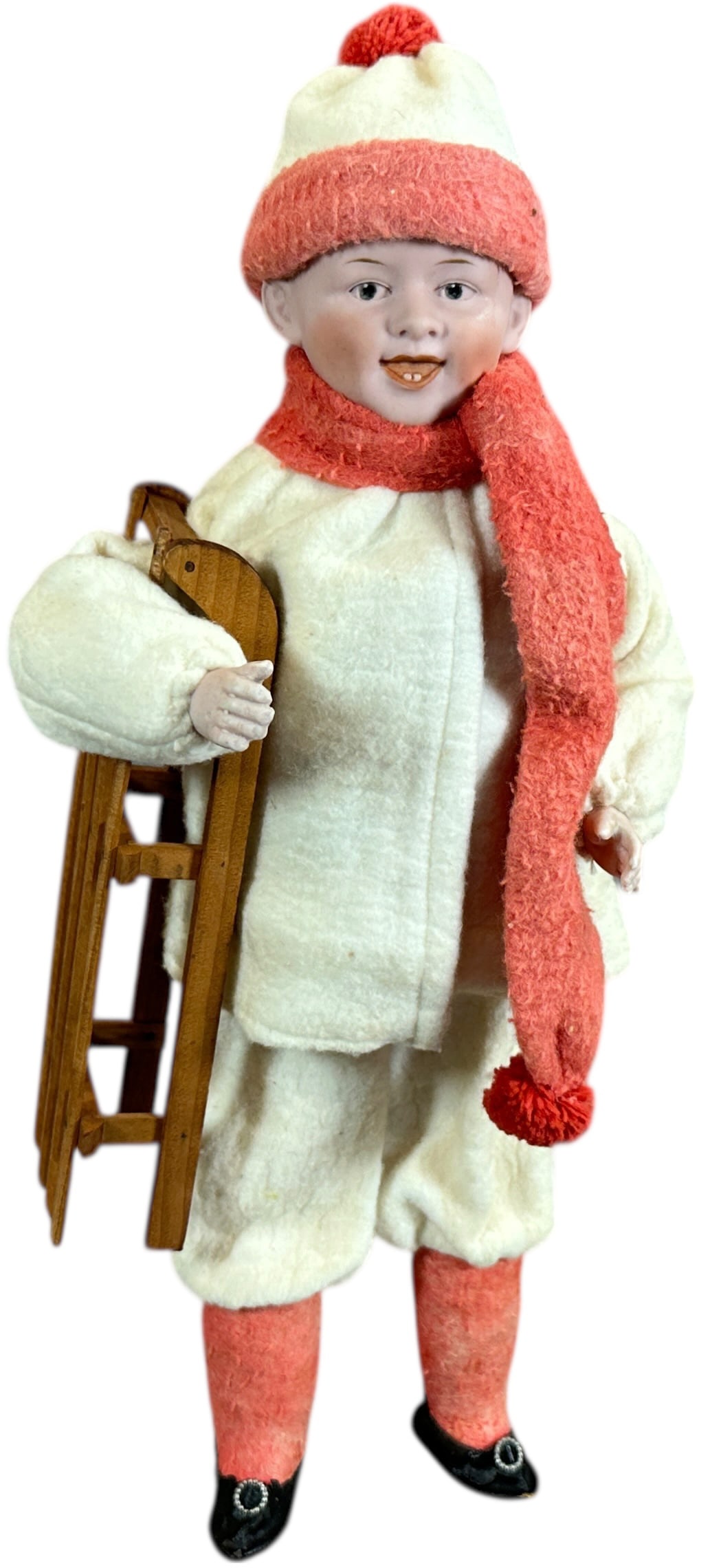 TALL HEUBACH BOY W/ SLED CANDY CONTAINER: 1089. TALL HEUBACH BOY W/ SLED CANDY CONTAINER | Marked 9 on back of neck. Very Tall. Provenance: Bob & Maurine Young | 16" h. | Contemporary, (Pristine Condition) | $500 - $800