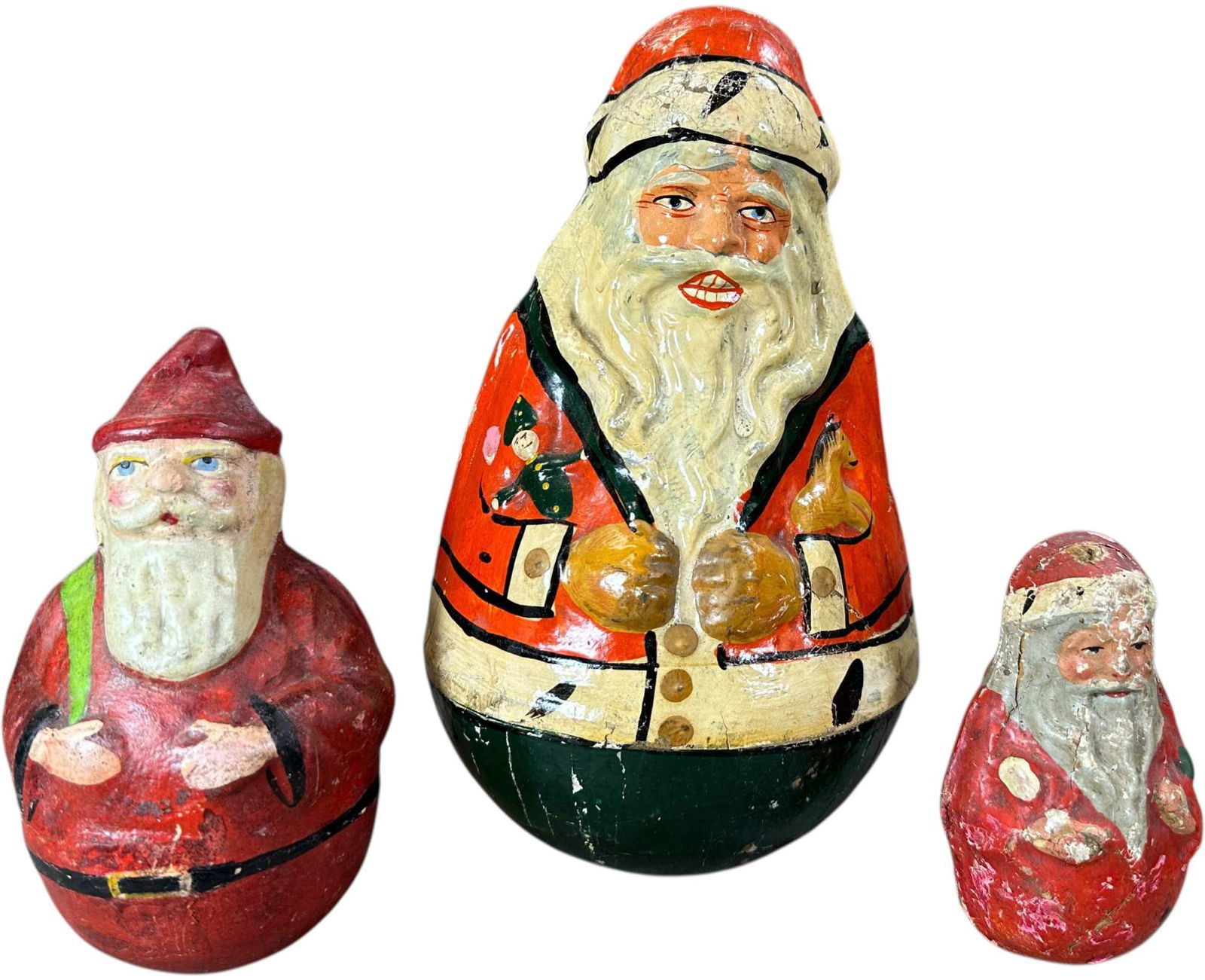 THREE SANTA ROLY POLY FIGURES: 1154. THREE SANTA ROLY POLY FIGURES | One is made by Schoenhut. Provenance: Beth Karp Collection. | 10.5" h. | (Very Good to Excellent Condition) | $500 - $800