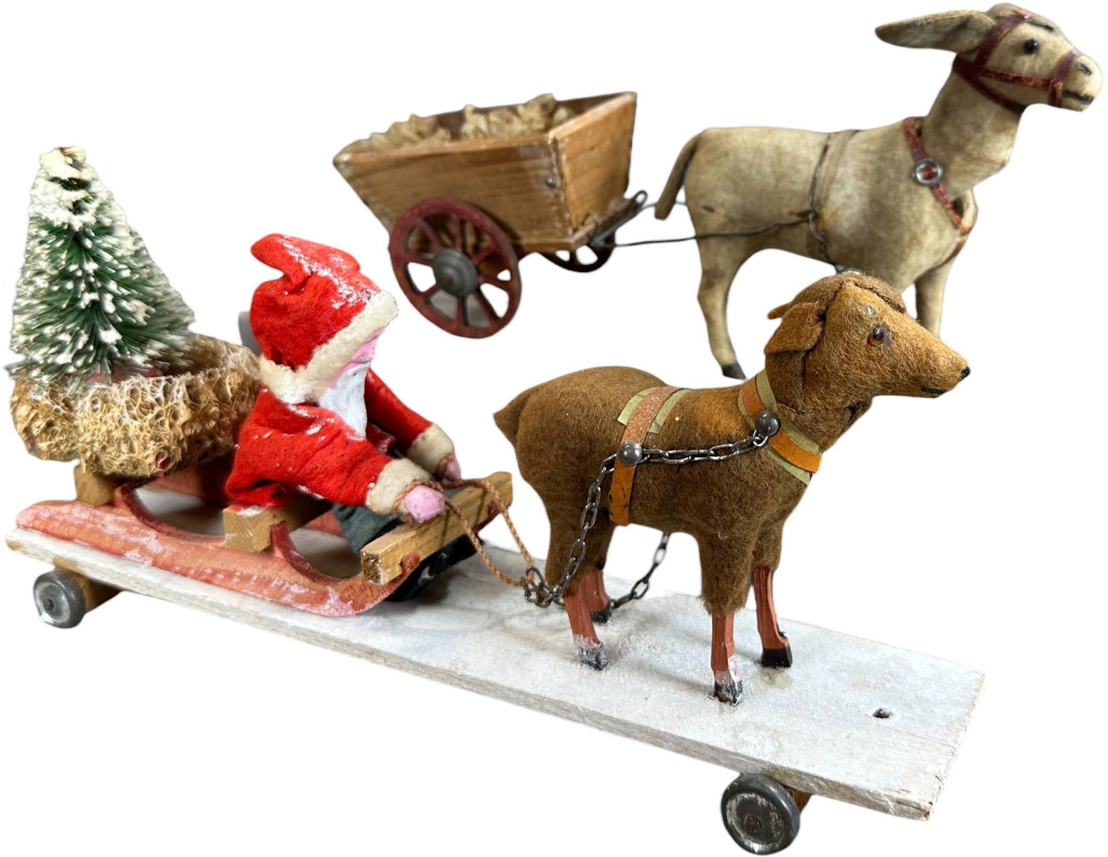 ANIMAL PULLED SANTA SLEIGH & CART: 1273. ANIMAL PULLED SANTA SLEIGH & CART | Donkey pulling cart German figures. Provenance: Linda Morrow Collection | 11" l. | (Excellent Condition) | $400 - $800