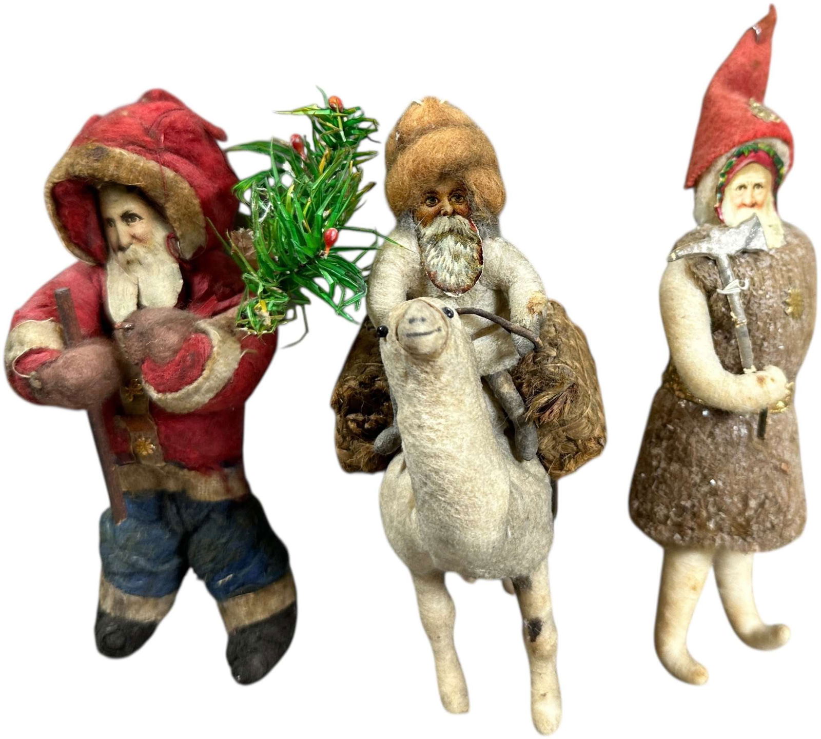 THREE COTTON SANTA ORNAMENTS: 1275. THREE COTTON SANTA ORNAMENTS | Provenance: Linda Morrow Collection | 5" h. | (Very Good to Excellent Condition) | $500 - $1,000