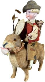 BISQUE HEAD BOY RIDING RABBIT CANDY CONTAINER