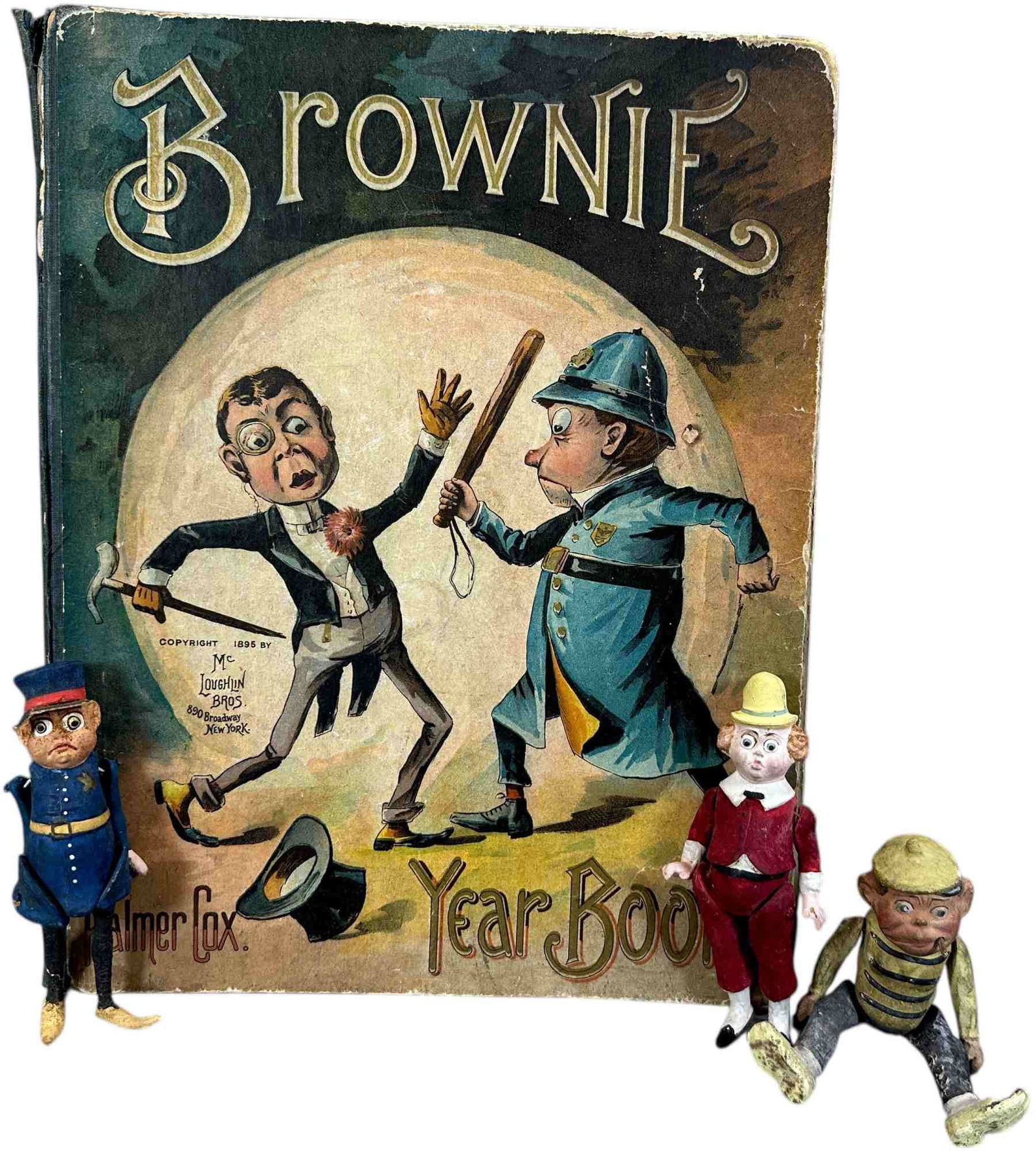 BROWNIE BOOK W/ GERMAN COMPO FIGURES: 1377. BROWNIE BOOK W/ GERMAN COMPO FIGURES | Age related wear. Provenance: Beth Karp Collection. | 12.5" h. | (Excellent Condition) | $500 - $900