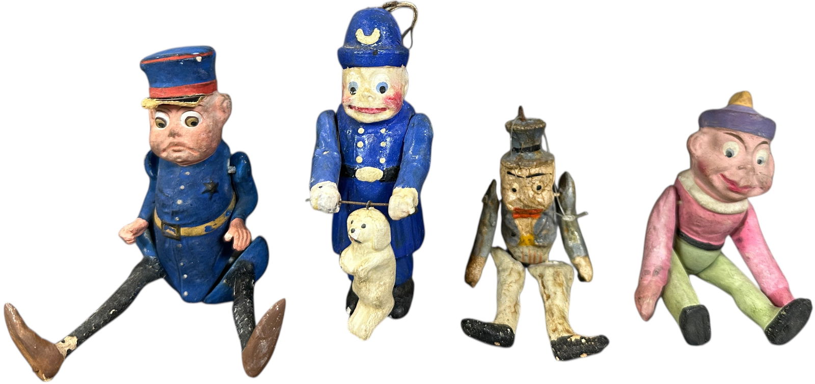 FOUR STRINGED FIGURES INCLUDES TWO BOBBIES: 1388. FOUR STRINGED FIGURES INCLUDES TWO BOBBIES | Provenance: Beth Karp Collection. | 5" h. | A few minor touchups, overall (Very Good to Excellent Condition) | $600 - $1,000