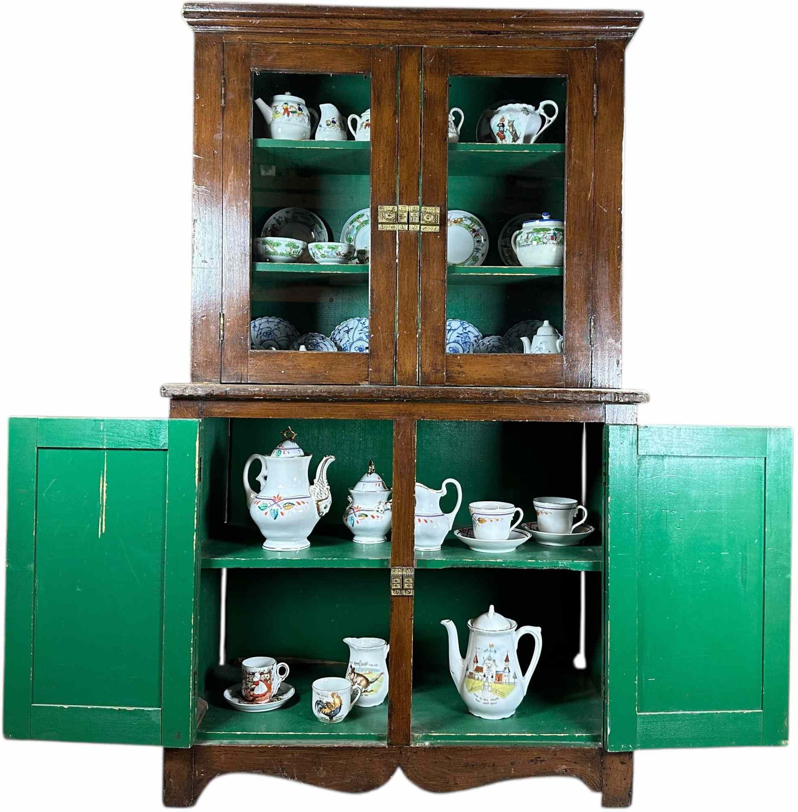 CHILDS ANTIQUE HUTCH W/ DISHES: 1443. CHILDS ANTIQUE HUTCH W/ DISHES | 25 x 34" lh. | Missing molding on top left corner, (Excellent Condition) | $400 - $800