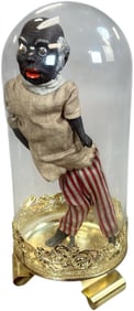 BLACK MAN SQUEEZE TOY IN GLASS ENCLOSURE