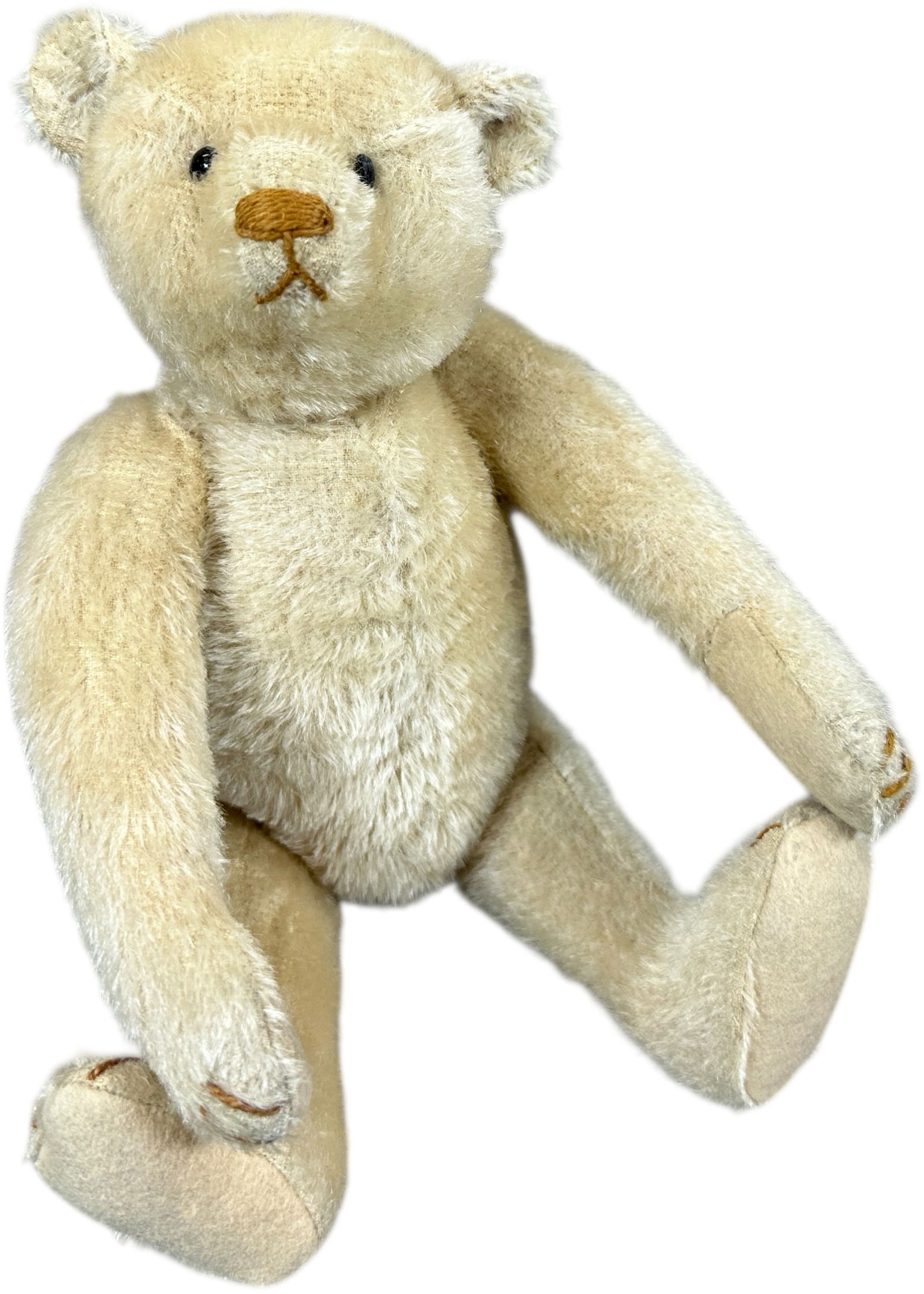 1907 STEIFF WHITE BEAR: 1482. 1907 STEIFF WHITE BEAR | Brown stitched nose and mouth, shoe button eyes, FF button, more rare shorter hair version. | 12" h. | Some thinning of hair, (Excellent Condition) | $800 - $1,400