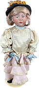 KAMMER & REINHART 101 MARIE DOLL: 1485. KAMMER & REINHART 101 MARIE DOLL | Classic character with blue painted eyes and molded facial features, originally fully jointed pink body, original blond mohair wig with braids, head incised "K