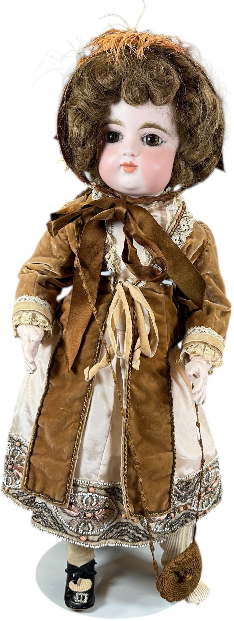 ATTRACTIVE 1890S GAULTHIER BEBE: 1502. ATTRACTIVE 1890S GAULTHIER BEBE | Closed mouth brown eyed child, incised "FG9" (in Cartouche logo), huge paperweight eyes, closed mouth, pierced earlobes, original body, brown human hair wig. |