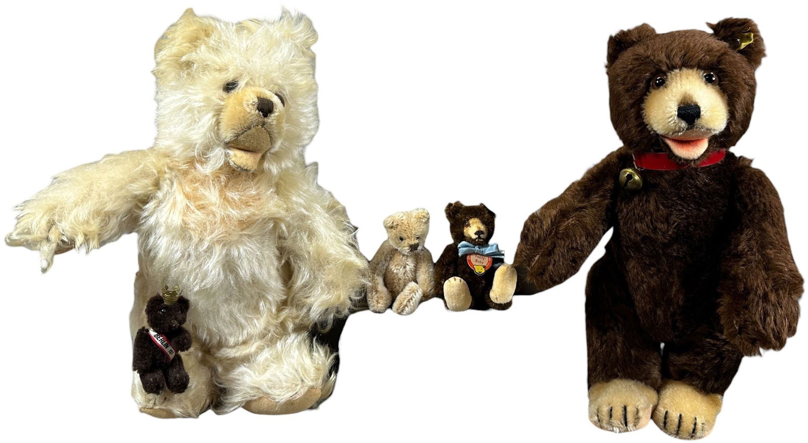 FIVE SMALLER STUFFED BEARS: 1524. FIVE SMALLER STUFFED BEARS | C. 1950's - 1960's, Lot includes a Brown Steiff Teddy Baby, a miniature Teddy Baby with all tags, a rare White Steiff Zotty bear, a beige Steiff jointed miniature Te