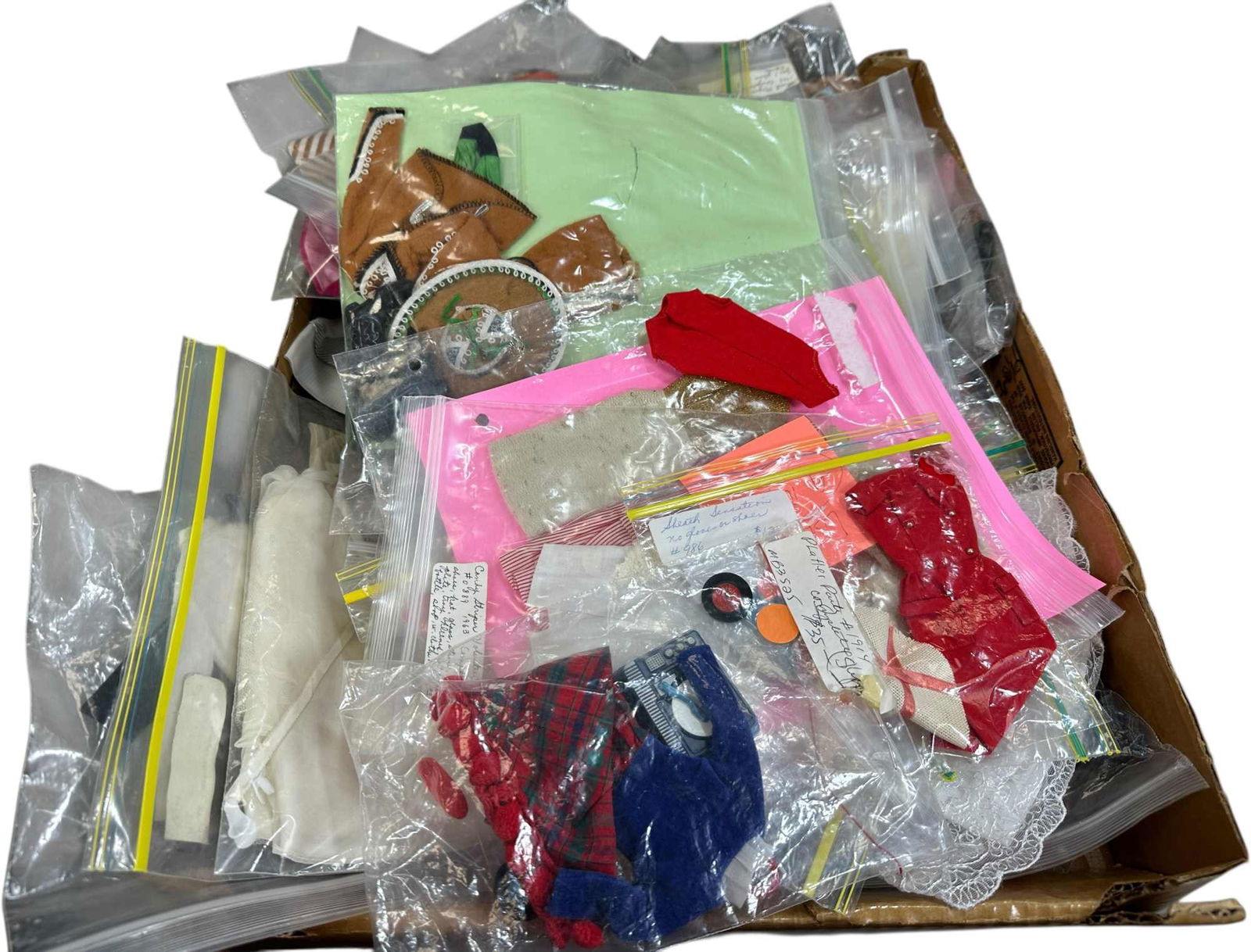 GROUPING OF BARBIE, MIDGE, KEN & SKIPPER CLOTHING: 1540. GROUPING OF BARBIE, MIDGE, KEN & SKIPPER CLOTHING | Sizes range 3" -10" l. | (Very Good to Excellent Condition) | $400 - $800