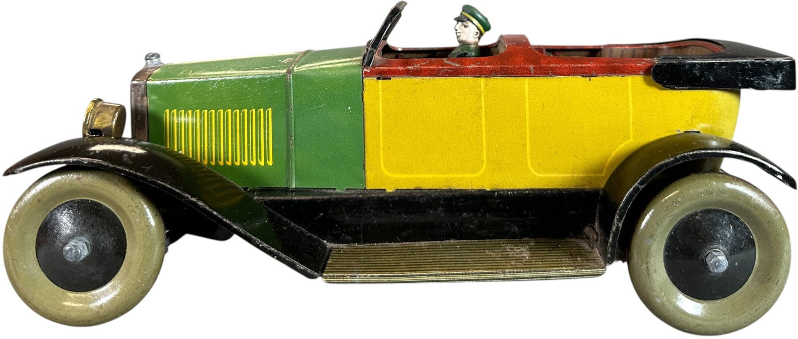 JEP MULTICOLOR OPEN SEDAN: 73. JEP MULTICOLOR OPEN SEDAN | France, wind-up motor driven. | 10.5" l. | Original driver figure and headlights, (Excellent Condition) | $600 - $1,200