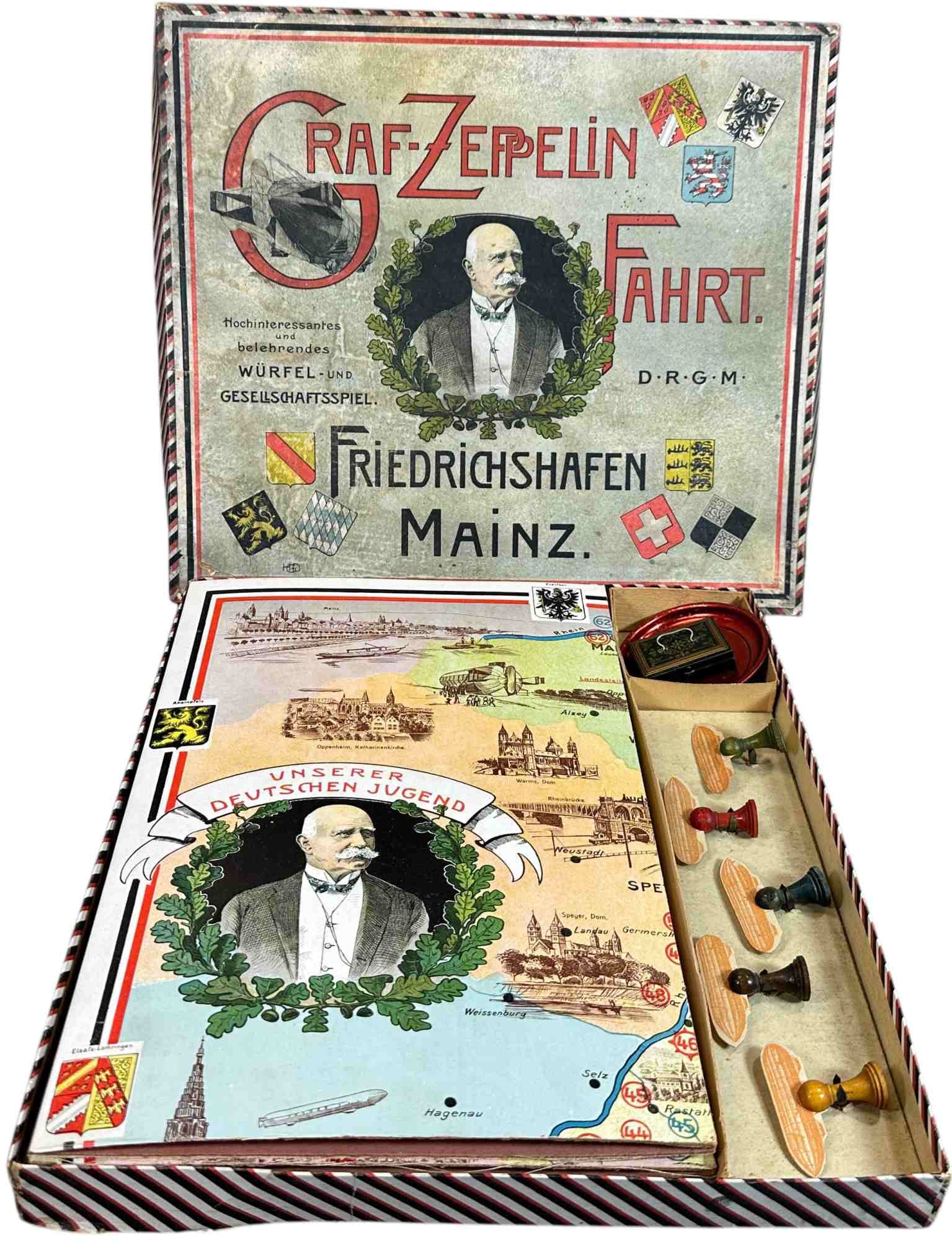 GERMAN ZEPPELIN BOARD GAME: 79. GERMAN ZEPPELIN BOARD GAME | Graf-Zeppelin Fahrt. | 14" l. box | Appears complete (Excellent Condition) | $300 - $600
