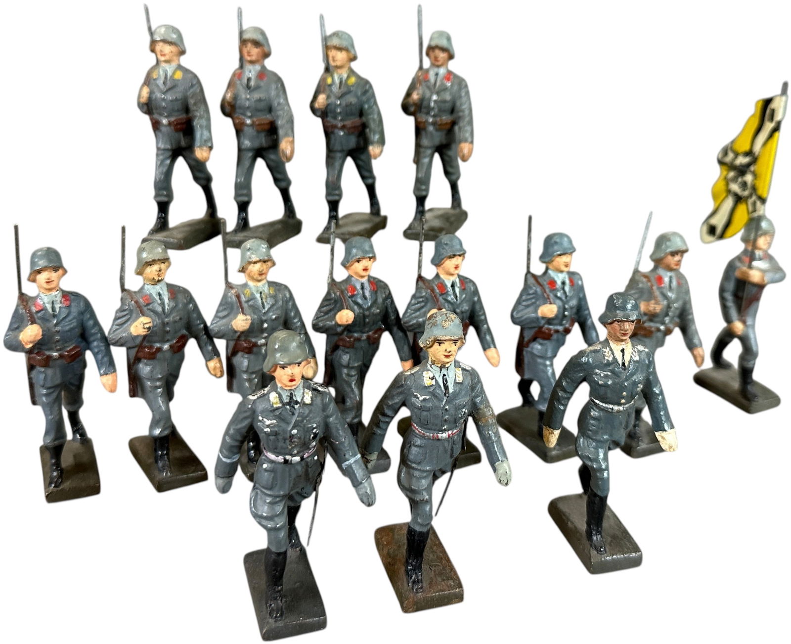 LINEOL MARCHING LUFTWAFFE IN STEEL HELMETS: 96. LINEOL MARCHING LUFTWAFFE IN STEEL HELMETS | Fifteen marching Luftwaffe to include three officers, one flag bearer, three flying corps, and eight AA corps soldiers. | 75mm | CULTURAL DISCLAIMER: