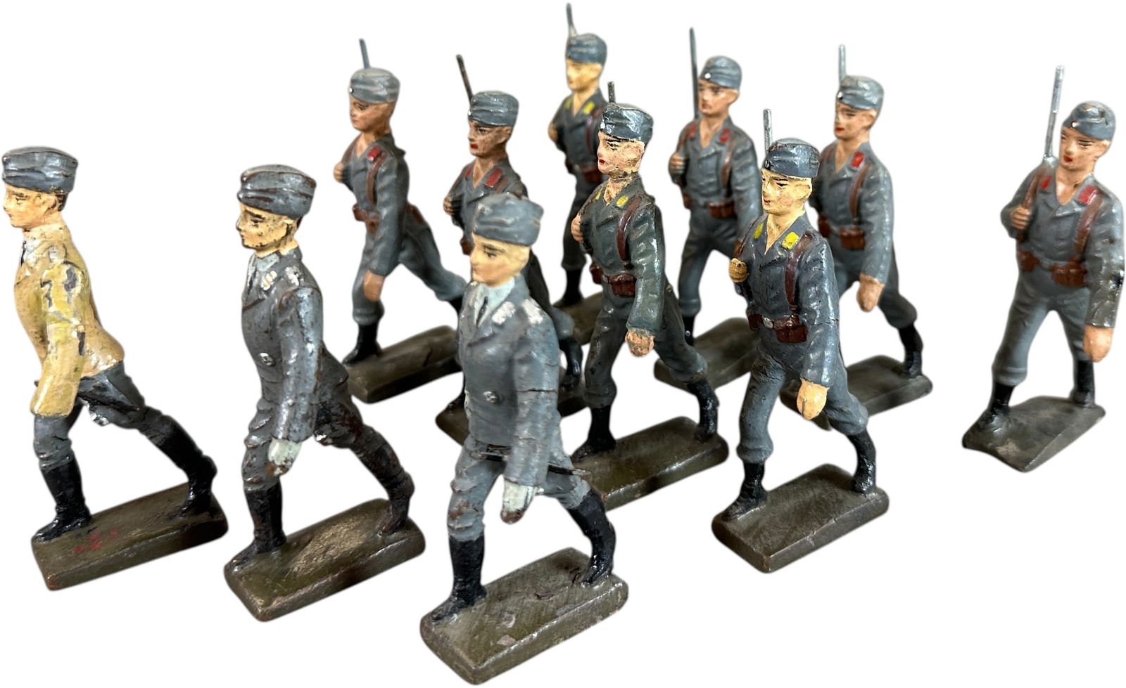 LINEOL MARCHING LUFTWAFFE IN CAMPAIGN HATS: 108. LINEOL MARCHING LUFTWAFFE IN CAMPAIGN HATS | Eleven scarce marching Luftwaffe including five AA corp with red tab collars, three fliers with yellow tabs, two officers and one rare pilot in tan fl
