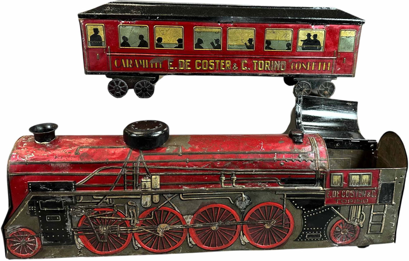 OVERSIZED TORINO ITALY BISCUIT TIN TRAIN SET: 139. OVERSIZED TORINO ITALY BISCUIT TIN TRAIN SET | 23.5" l. | Coach roof has been overpainted with one replacement truck, some punctures to underside of coach, engine has replaced roof and dome with