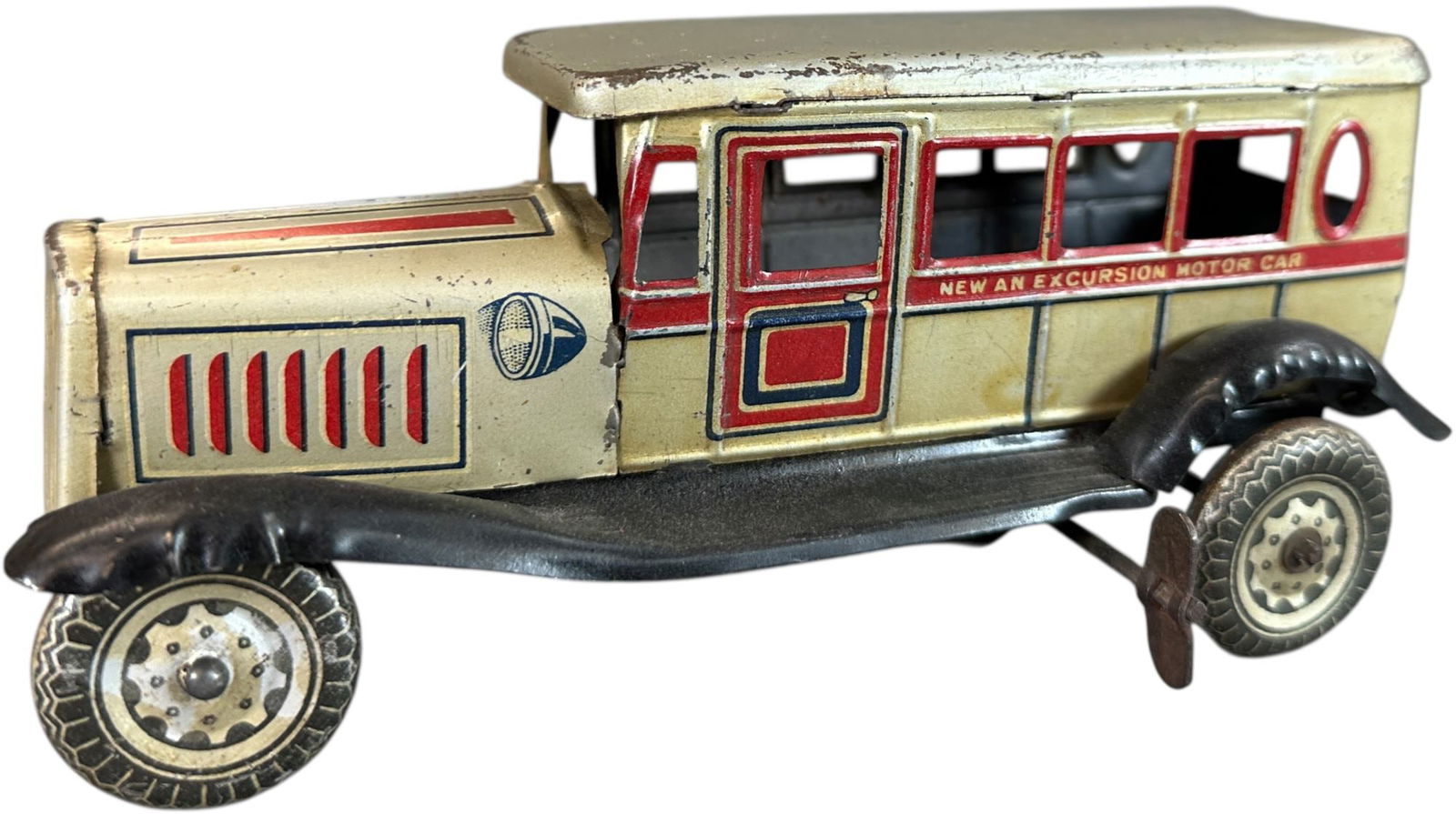 KORUMACHI NEW AN EXCURSION MOTOR CAR: 224. KORUMACHI NEW AN EXCURSION MOTOR CAR | Japan, wind-up driven motion. | 7.5" l. | (Very Good to Excellent Condition) | $400 - $700