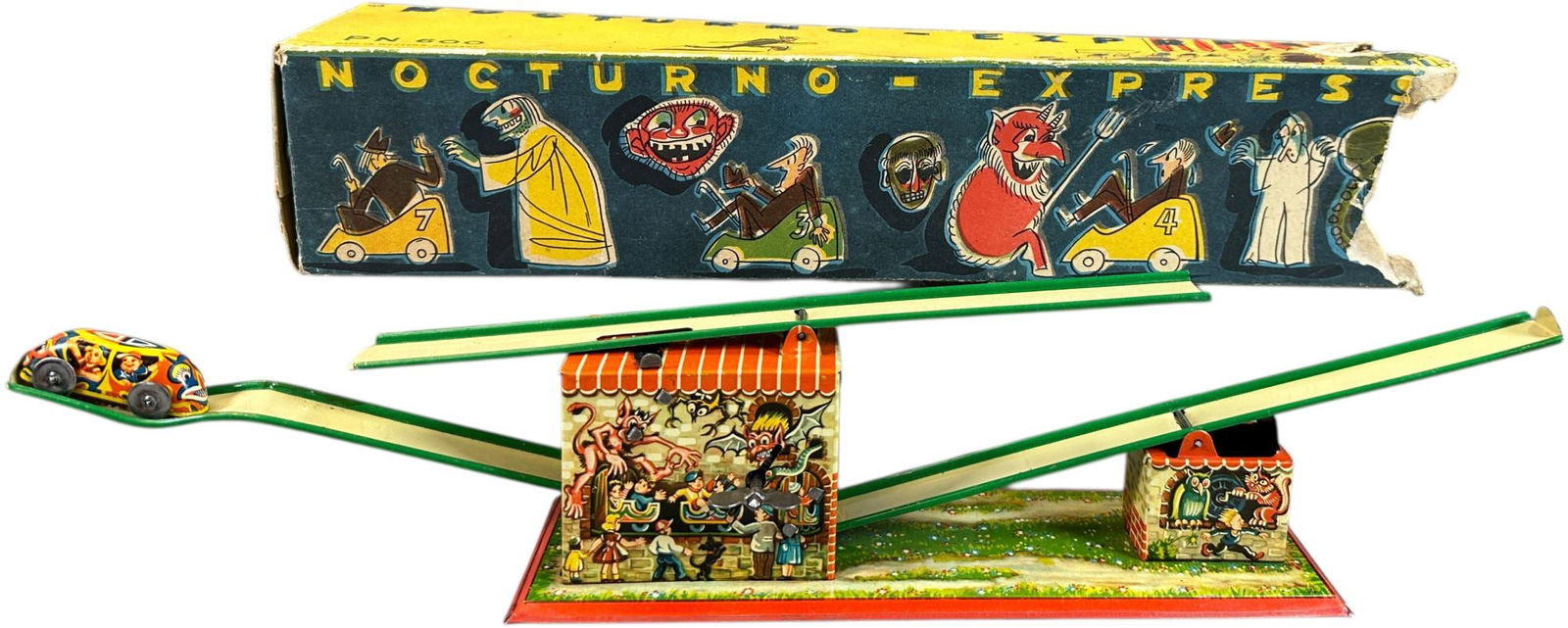 PHILLIP NIEDERMEIER BOXED NOCTURNO EXPRESS: 261. PHILLIP NIEDERMEIER BOXED NOCTURNO EXPRESS | Rare variation, Germany, wind-up driven motion, toy has great spooky graphics! | 17" l. | Wonderful graphic covered box has endflaps torn on one