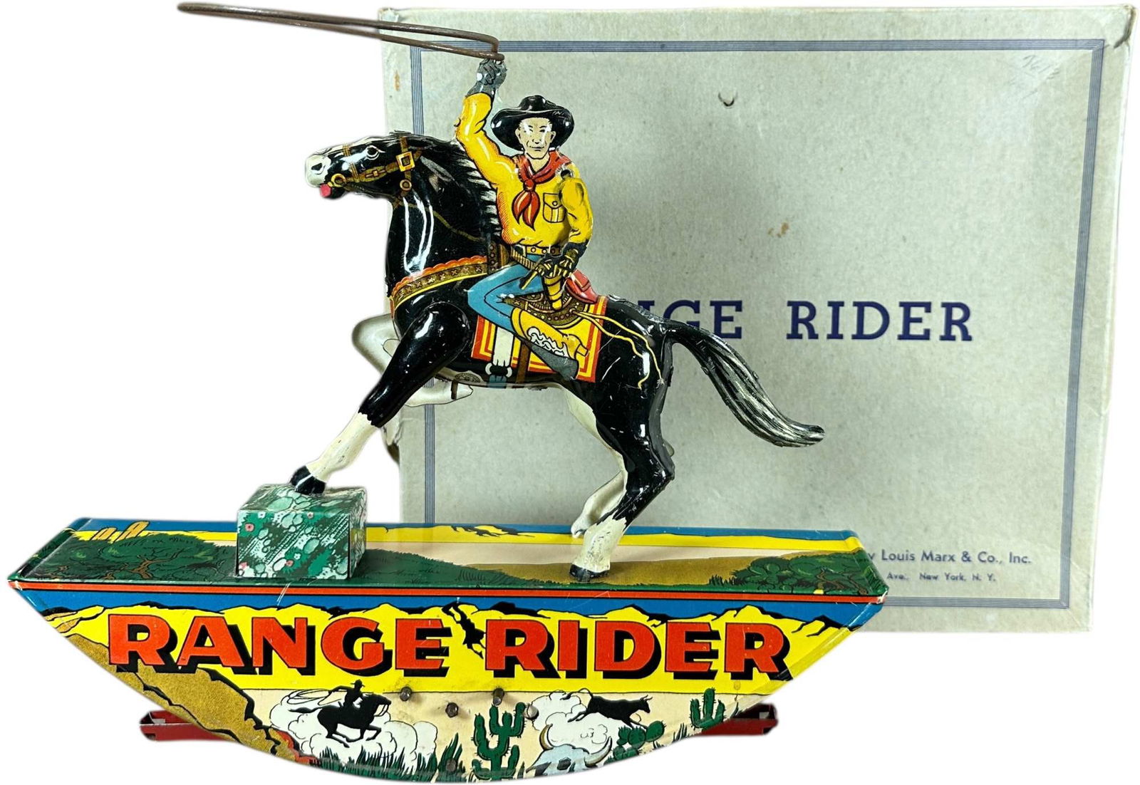 BOXED MARX RANGE RIDER - DARK HORSE: 422. BOXED MARX RANGE RIDER - DARK HORSE | USA, wind-up motor driven. | 11" l. | Handling wear and minor tear to box, toy in (Excellent to Pristine Condition) | $250 - $500