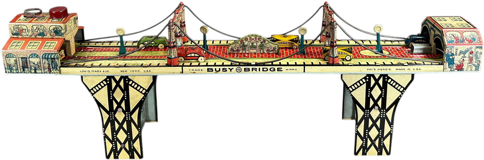 MARX BUSY BRIDGE TOY: 477. MARX BUSY BRIDGE TOY | USA, wind-up motor driven. | 25" l. | (Excellent Condition) | $200 - $400