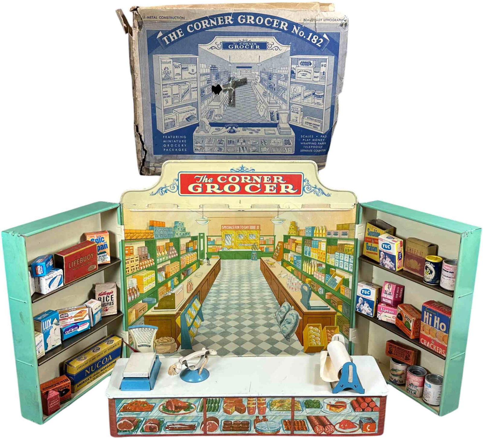 BOXED WOLVERINE CORNER GROCER NO. 182: 486. BOXED WOLVERINE CORNER GROCER NO. 182 | 16" w. | Box has age related wear and tear, toy in (Excellent Condition) | $200 - $400