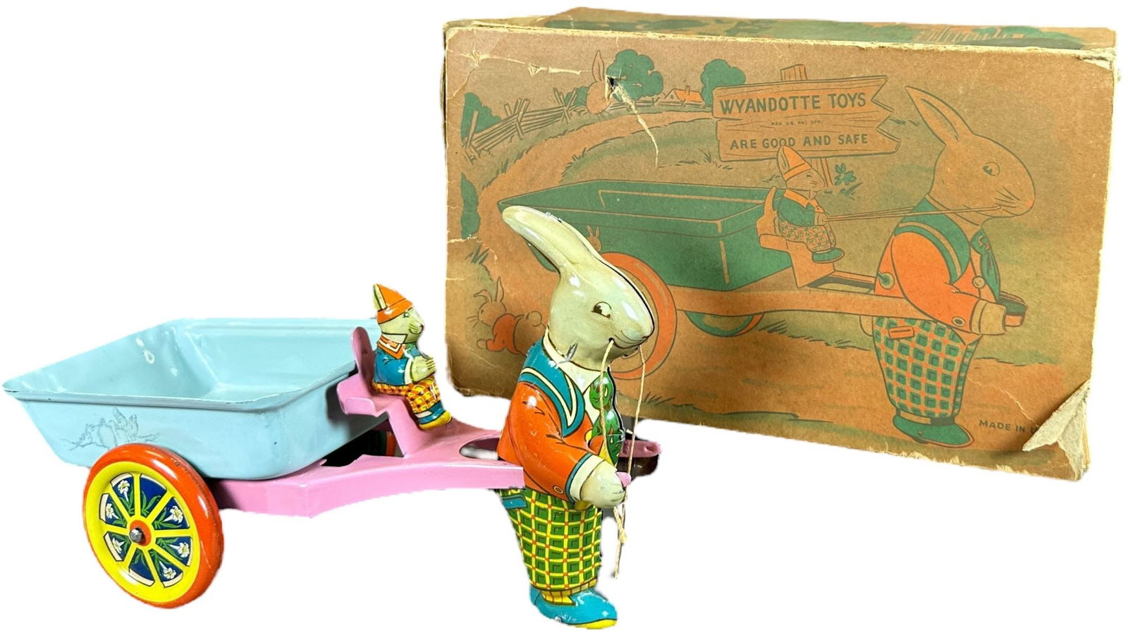 BOXED WYANDOTTE EASTER RABBIT CART: 487. BOXED WYANDOTTE EASTER RABBIT CART | 10" l. | Rare box has some missing endflaps and tear to middle of one side (Very Good Condition), toy in (Pristine Condition) | $200 - $400