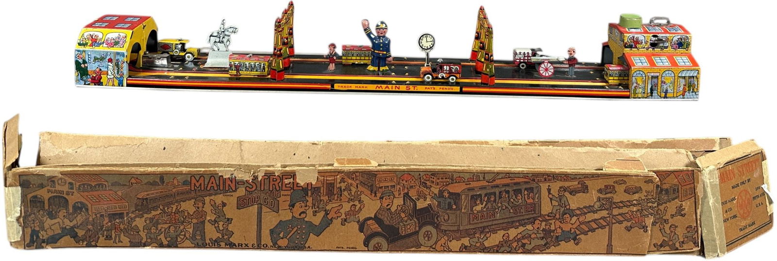 BOXED MARX MAIN STREET: 490. BOXED MARX MAIN STREET | USA, wind-up motor driven. | 24" l. | Box has wear and tears protected inside plastic shrink-wrap, toy in (Excellent Condition) | $200 - $400