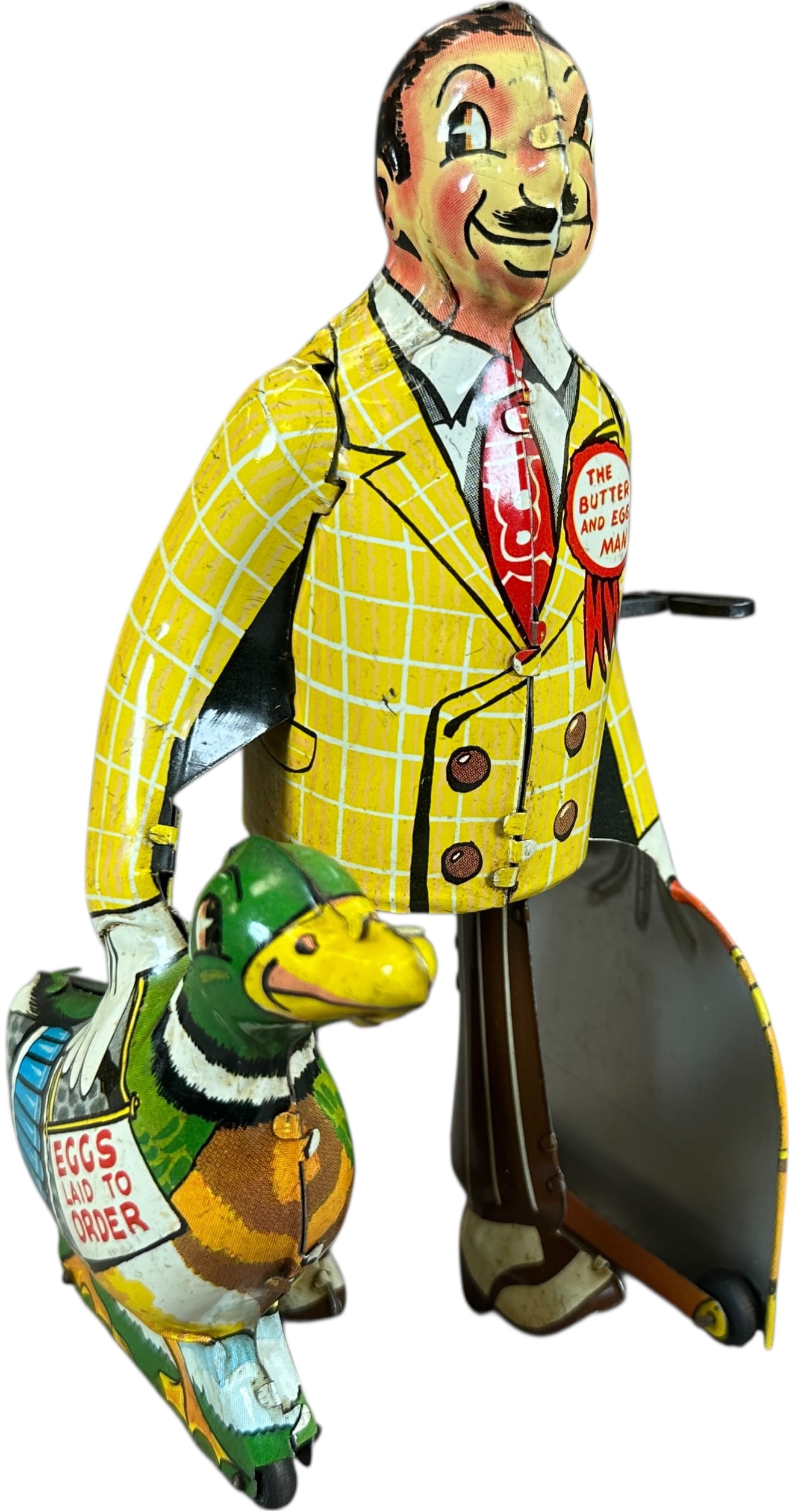 MARX BUTTER & EGG MAN: 493. MARX BUTTER & EGG MAN | USA, wind-up motor driven. | 8.5" h. | (Excellent Condition) | $250 - $500