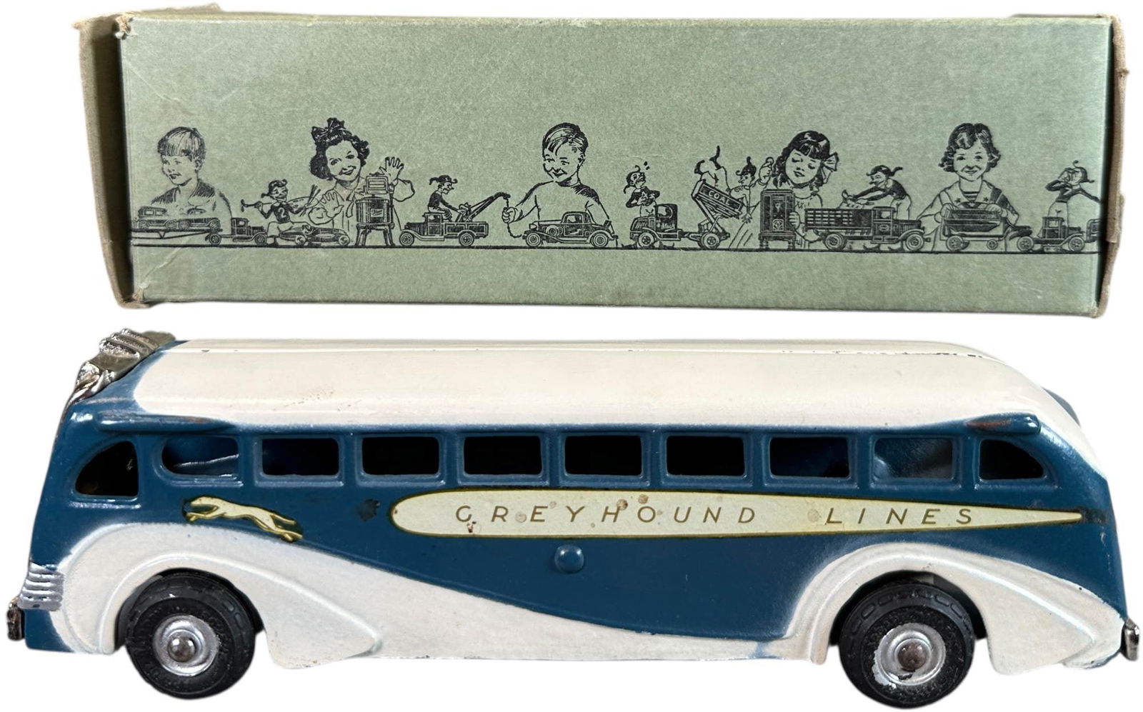 BOXED ARCADE GREYHOUND LINES BUS: 12. BOXED ARCADE GREYHOUND LINES BUS | 9" l. | Box is complete with only one tear to seam of flap, toy is unplayed with (Near Mint Condition) | $400 - $800