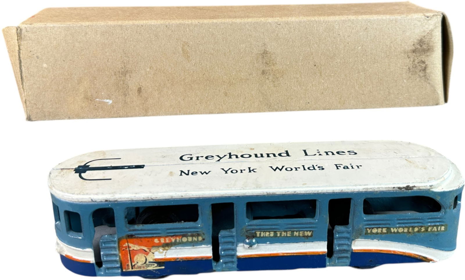 BOXED ARCADE NY WORLDS FAIR BUS: 14. BOXED ARCADE NY WORLDS FAIR BUS | 8.5" l. | Cardboard box fits nicely but possibly added, toy in (Pristine Condition) | $300 - $500