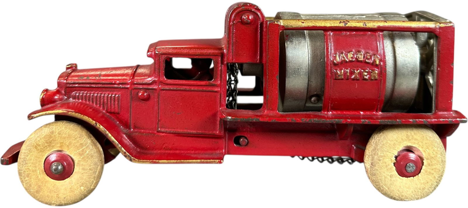 KENTON JAEGER CEMENT TRUCK: 21. KENTON JAEGER CEMENT TRUCK | Still retaining gold highlights on bars and edge of fenders! | 9.5" l. | Complete and all original (Excellent to Pristine Condition) | $800 - $1,400