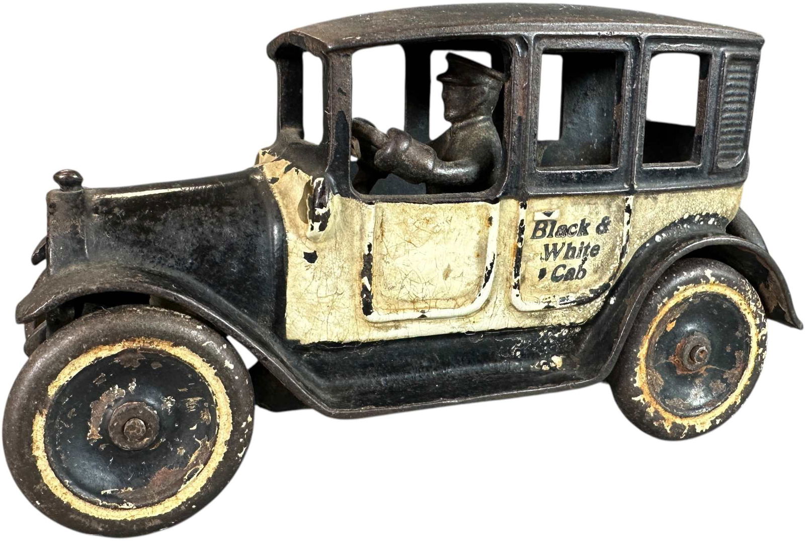 ARCADE BLACK & WHITE CAB: 32. ARCADE BLACK & WHITE CAB | 8" l. | Glued crack at rear edge of roof, (Very Good Condition) | $200 - $400