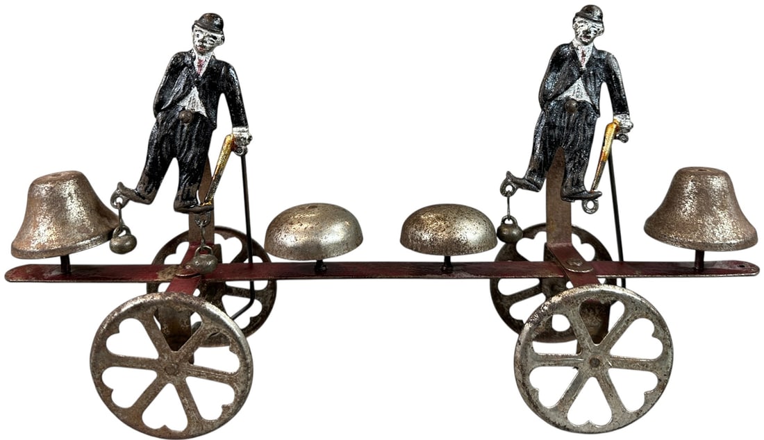 WATROUS DOUBLE CHARLIE CHAPLIN BELL TOY: 62. WATROUS DOUBLE CHARLIE CHAPLIN BELL TOY | Provenance: Richard Mueller Collection. | 13.5" l. | (Excellent Condition) | $400 - $800