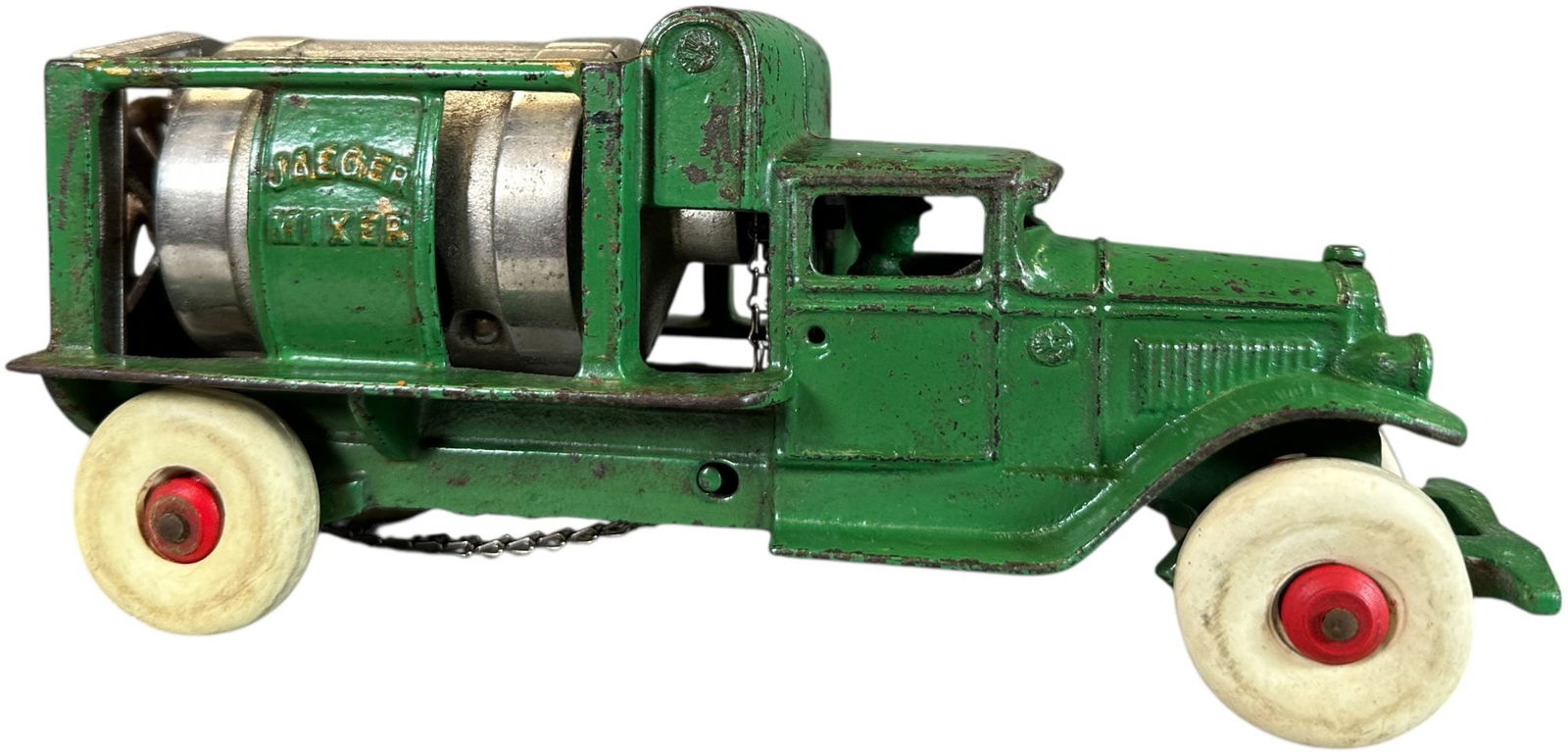 KENTON JAEGER CEMENT MIXER TRUCK: 84. KENTON JAEGER CEMENT MIXER TRUCK | 8.5" l. | Replaced rubber tires, some overpaint to cab, (Very Good Condition) | $300 - $600