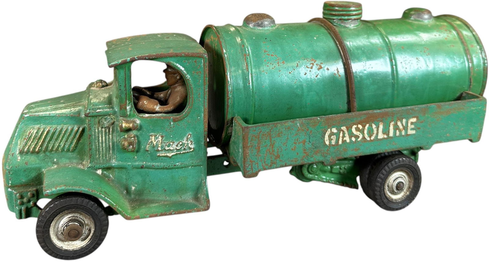 ARCADE MACK GASOLINE TRUCK: 86. ARCADE MACK GASOLINE TRUCK | Ex: Tony Lasala Collection. | 12.5" l. | Original cap, one side of "GASOLINE" frame appears to be old overpaint when viewed under black light UV, (Very Good to
