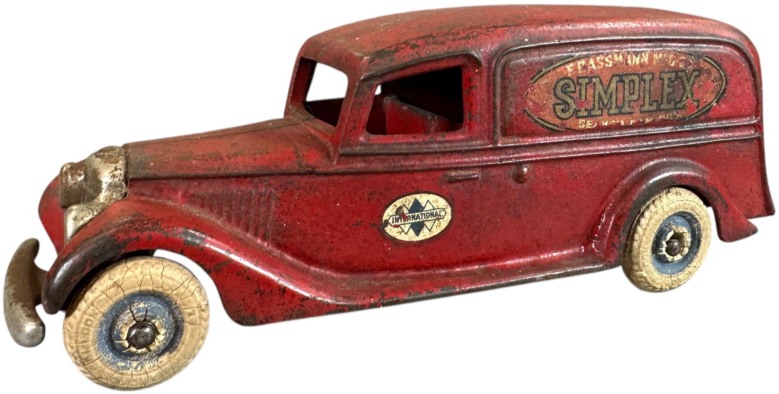 ARCADE INTERNATIONAL SIMPLEX DELIVERY VAN: 94. ARCADE INTERNATIONAL SIMPLEX DELIVERY VAN | Ex: Tony Lasala Collection. | 9" l. | Two original wheels loose at hubs, one replaced wheel, authentic paint and decal, (Very Good Condition) | $700 - $