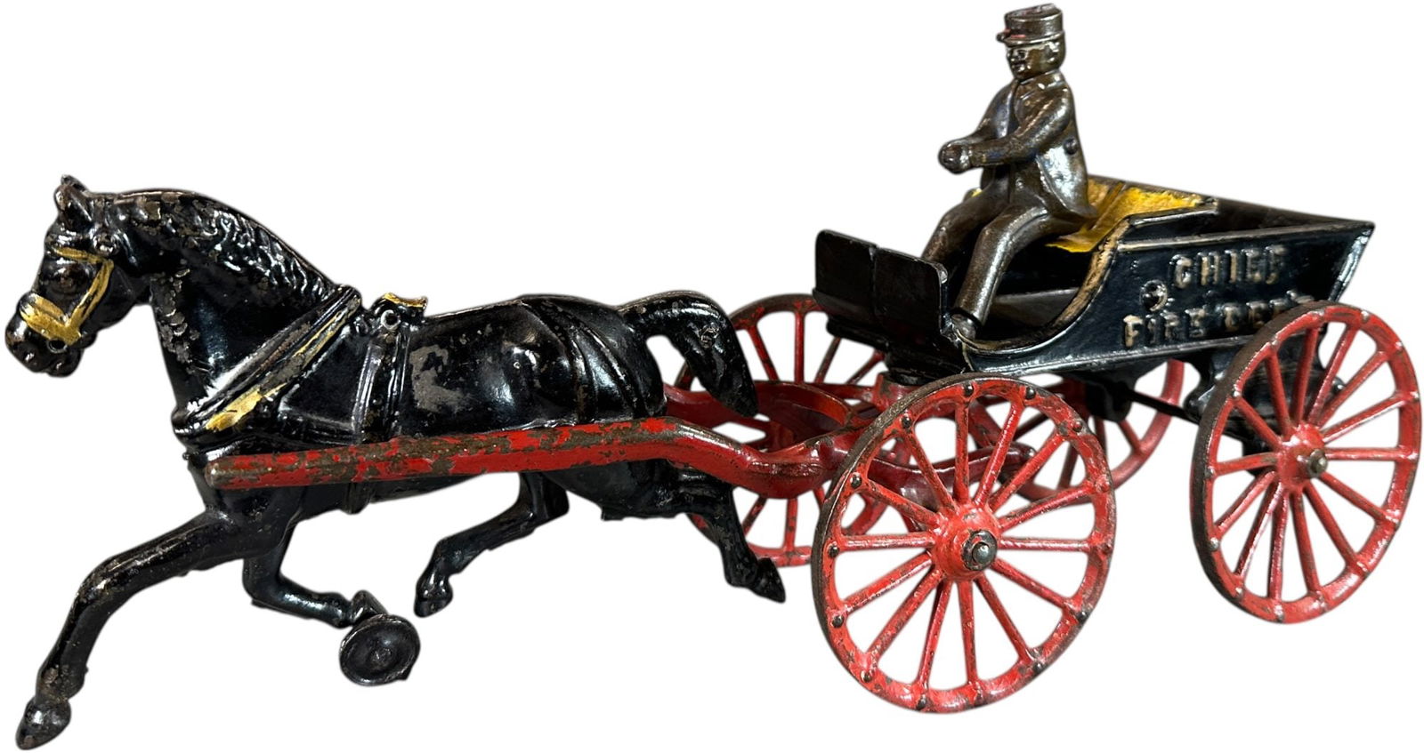 IVES FIRE CHIEF WAGON: 111. IVES FIRE CHIEF WAGON | 15.5" l. | Original figure, toy has been lacquered, outside of wheels and cart body are overpainted, displays in (Excellent Condition) | $300 - $600