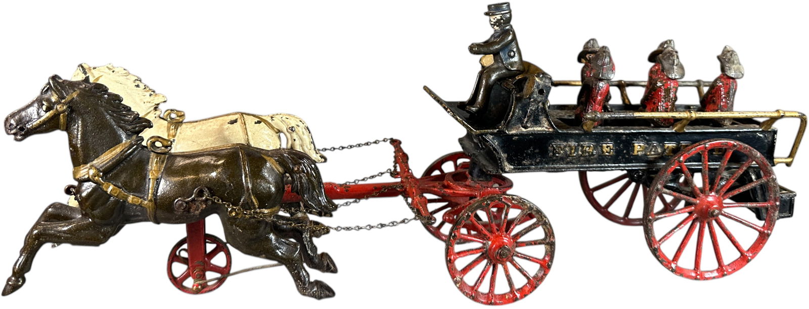 IVES FIRE PATROL WAGON: 112. IVES FIRE PATROL WAGON | This toy could clean up very nicely as it has some lacquer preservation in areas, includes original figures with only one passenger missing. | 21" l. | One front wheel