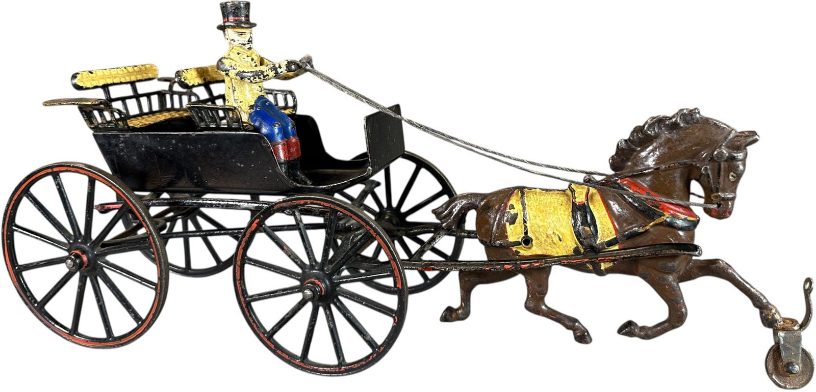 PRATT & LETCHWORTH TWO SEAT SURREY: 117. PRATT & LETCHWORTH TWO SEAT SURREY | Uncommon color variation of black wheels with red pinstripe and a dark brown horse with eye popping yellow saddle. | 15" l. | Original figure, this authentic