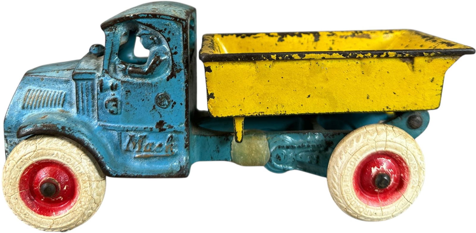 SMALL ARCADE MULTICOLOR DUMP TRUCK: 157. SMALL ARCADE MULTICOLOR DUMP TRUCK | 8" l. | Epoxy repair to one rear frame strut, (Very Good Condition) | $200 - $400