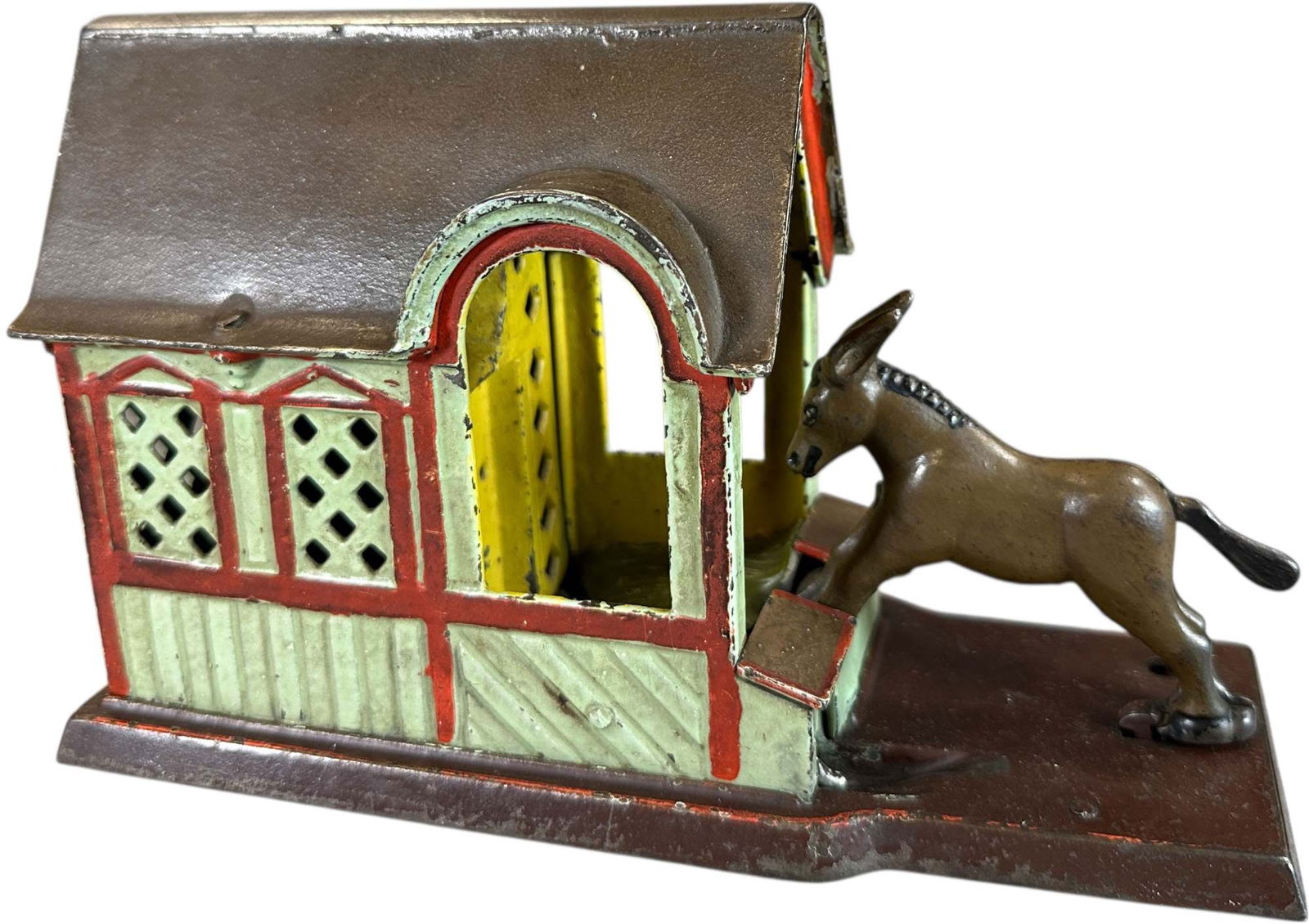 MULE ENTERING BARN MECHANICAL BANK: 237. MULE ENTERING BARN MECHANICAL BANK | J&E Stevens Co. | 8.5" l. | Original tail, free from the typical hairlines at roof, (Excellent Condition) | $400 - $800