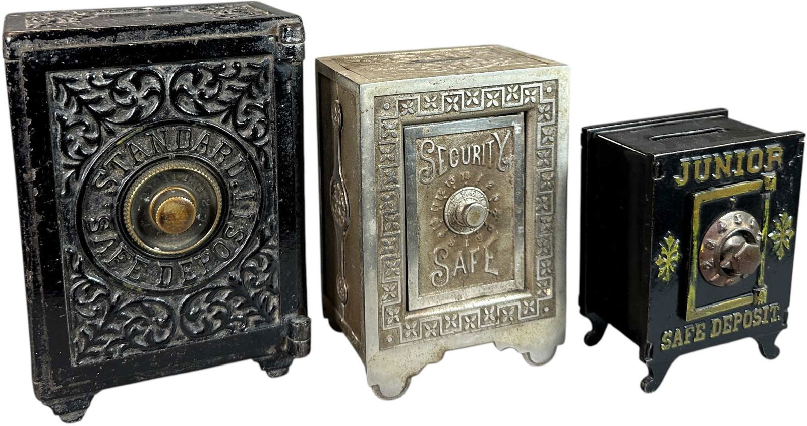 THREE SAFE STILL BANKS: 276. THREE SAFE STILL BANKS | Standard Safe Deposit and Security Safe | 7" h. | Standard Bank missing small side insert, (Very Good to Excellent Condition) | $200 - $400
