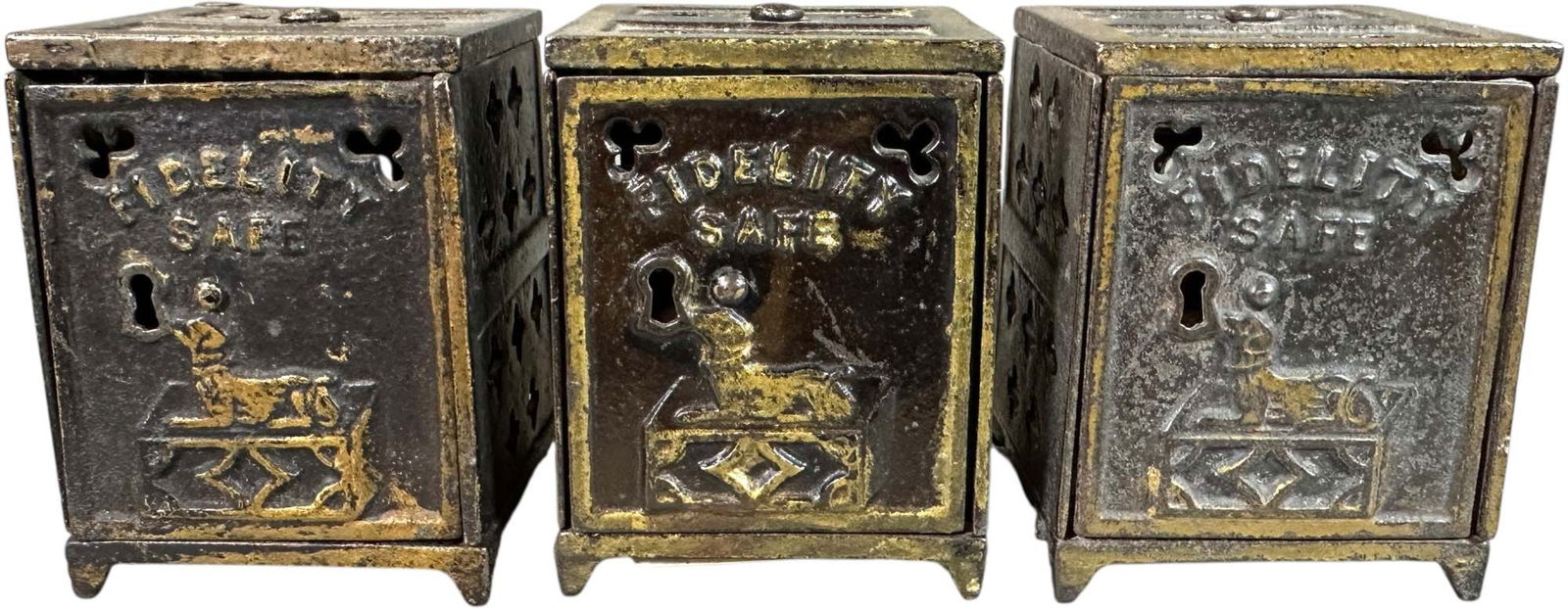 THREE SMALL FIDELITY SAFE BANKS: 323. THREE SMALL FIDELITY SAFE BANKS | 3" h. | (Excellent Condition) | $200 - $400