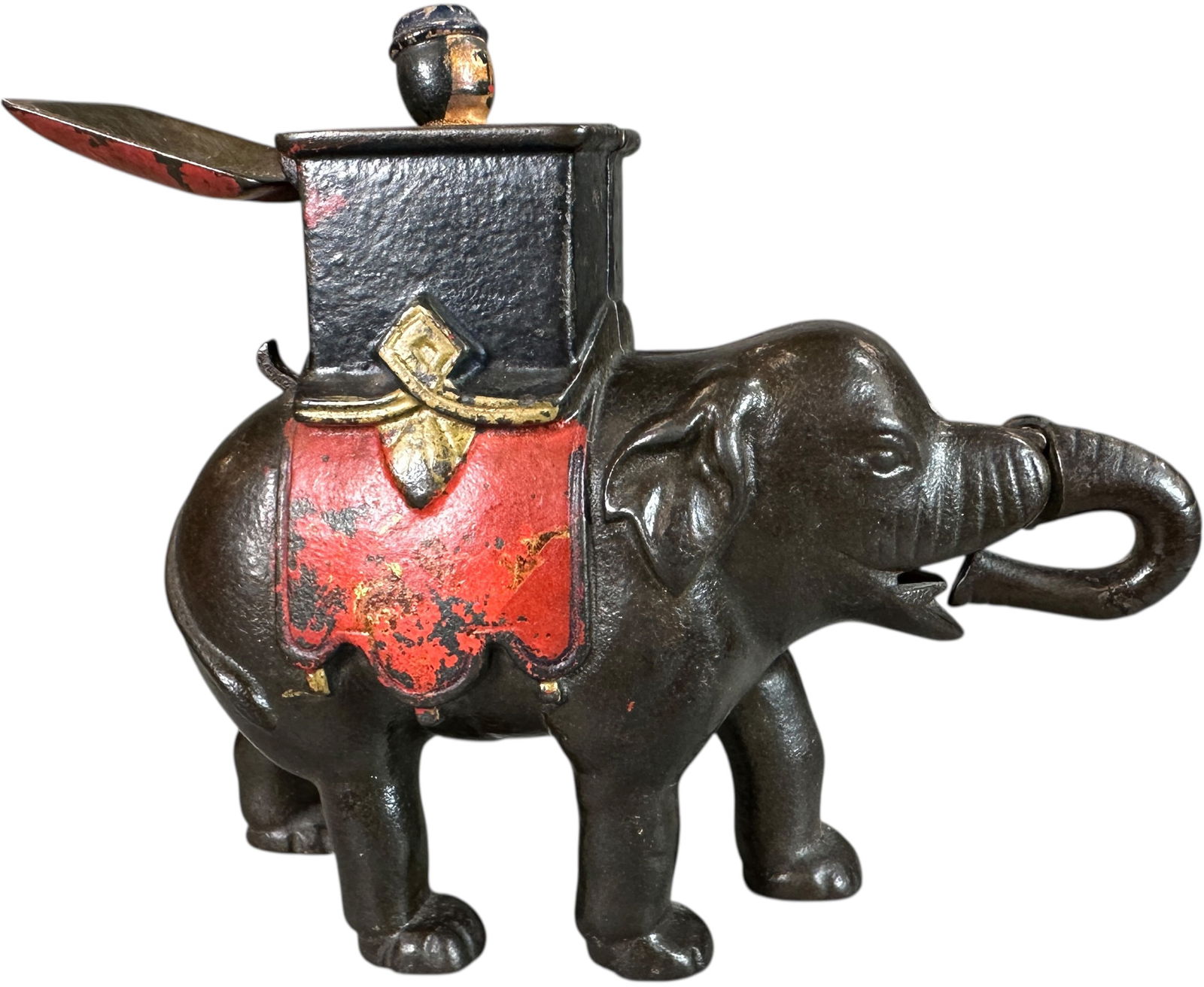 ELEPHANT HOWDAH MAN POPS OUT MECHANICAL BANK: 352. ELEPHANT HOWDAH MAN POPS OUT MECHANICAL BANK | Enterprise Mfg., Philadelphia, PA. | 7" l. | (Very Good to Excellent Condition) | $300 - $600