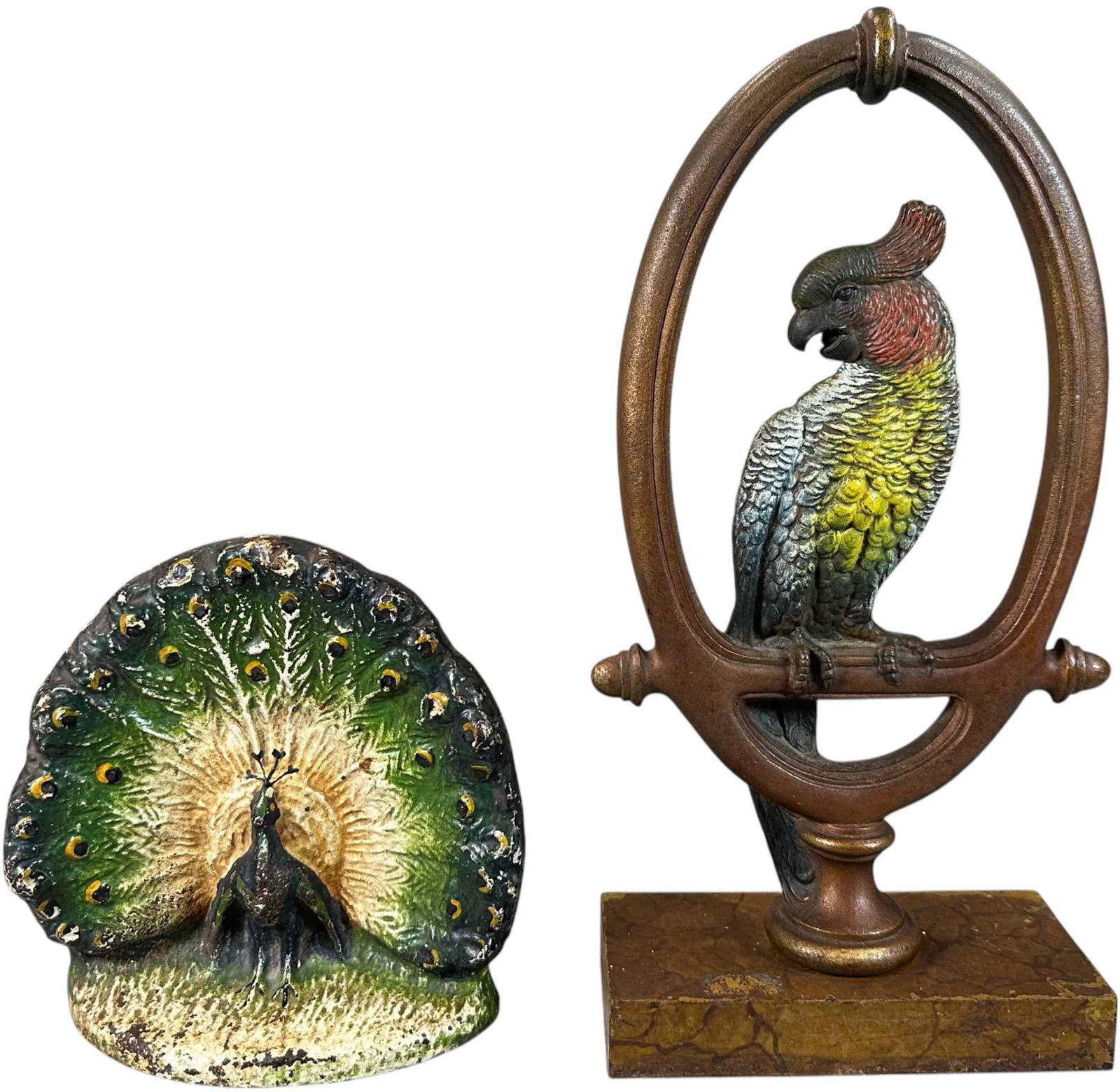 STYLIZED PEACOCK AND COCKATOO IN RING DOORSTOPS: 370. STYLIZED PEACOCK AND COCKATOO IN RING DOORSTOPS | Cjo cockatoo | 13" h. | Peacock (Excellent Condition), Cockatoo (Pristine Condition) | $200 - $400